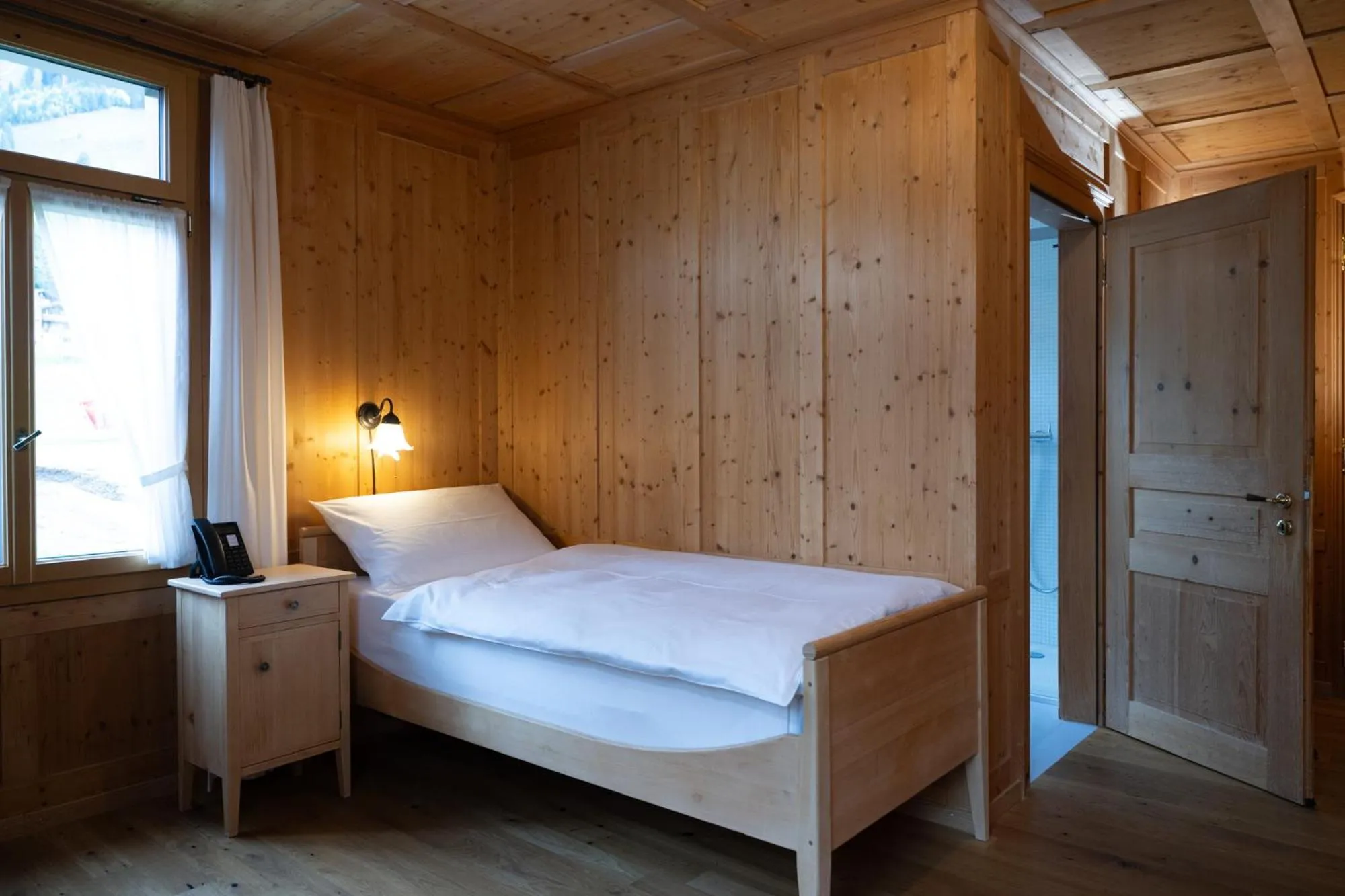 Bed in FLÜHLI Hotel Kurhaus