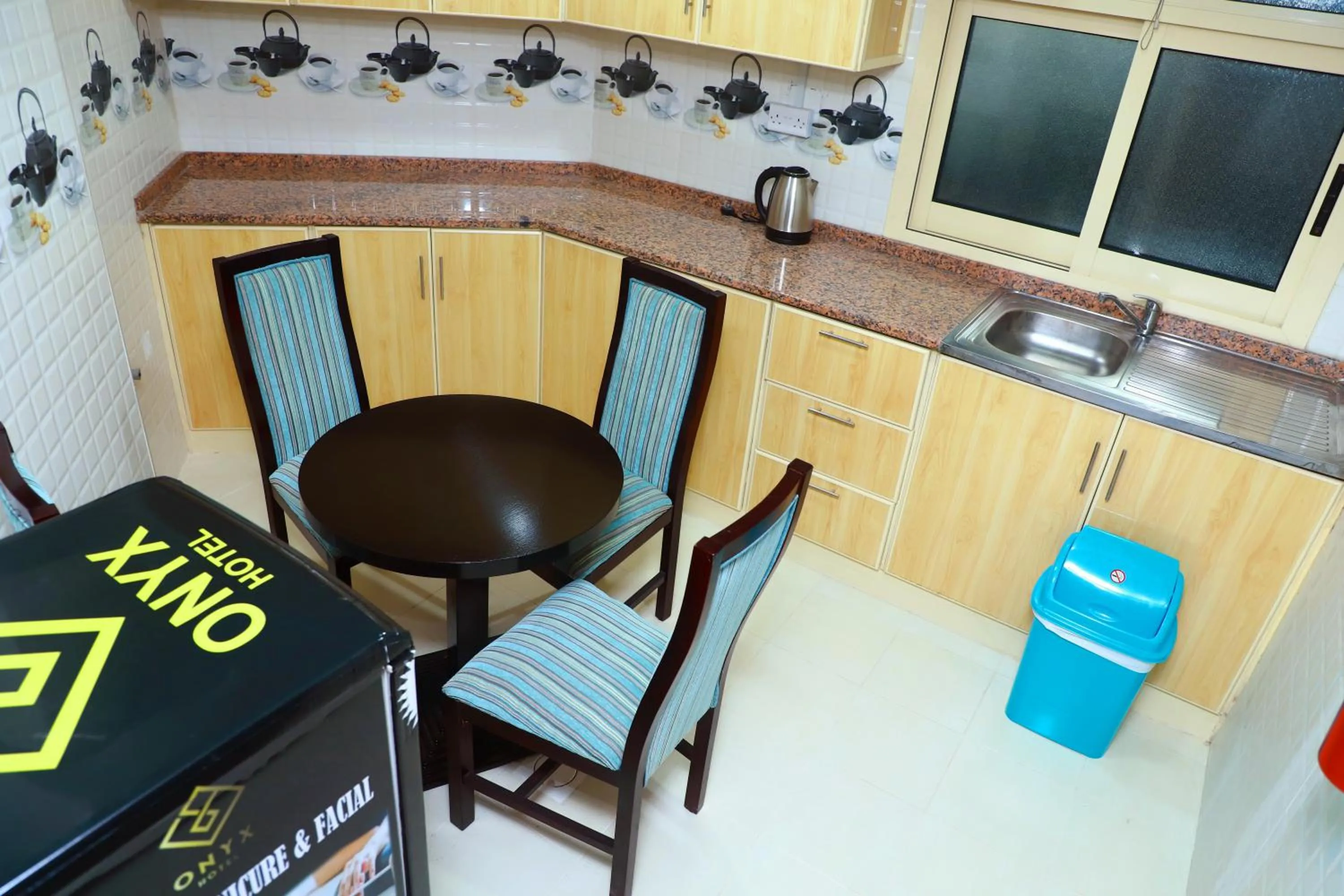 Kitchen or kitchenette in Onyx Hotel Apartments - MAHA HOSPITALITY GROUP