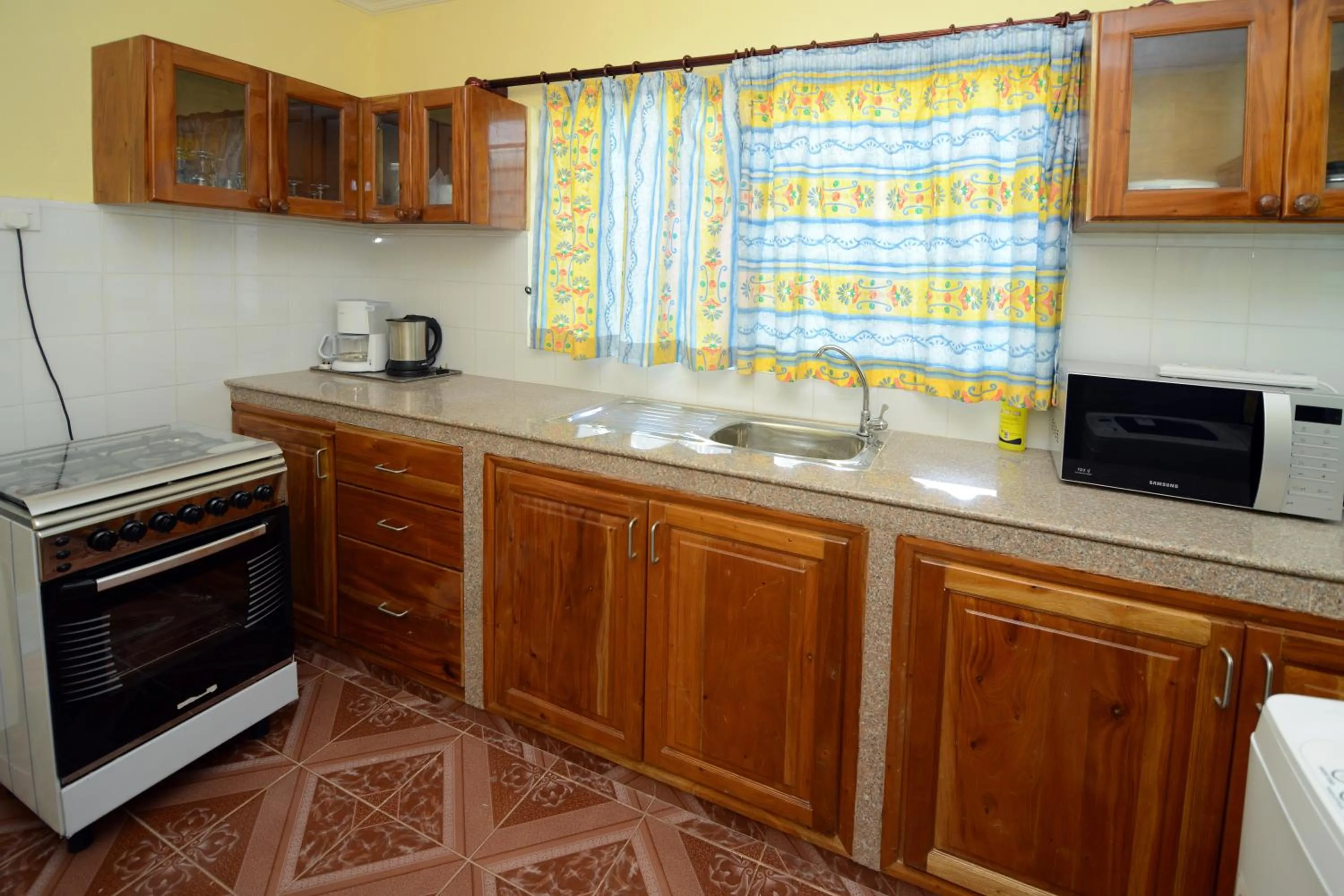 Communal kitchen in Le Relax Self Catering Apartment