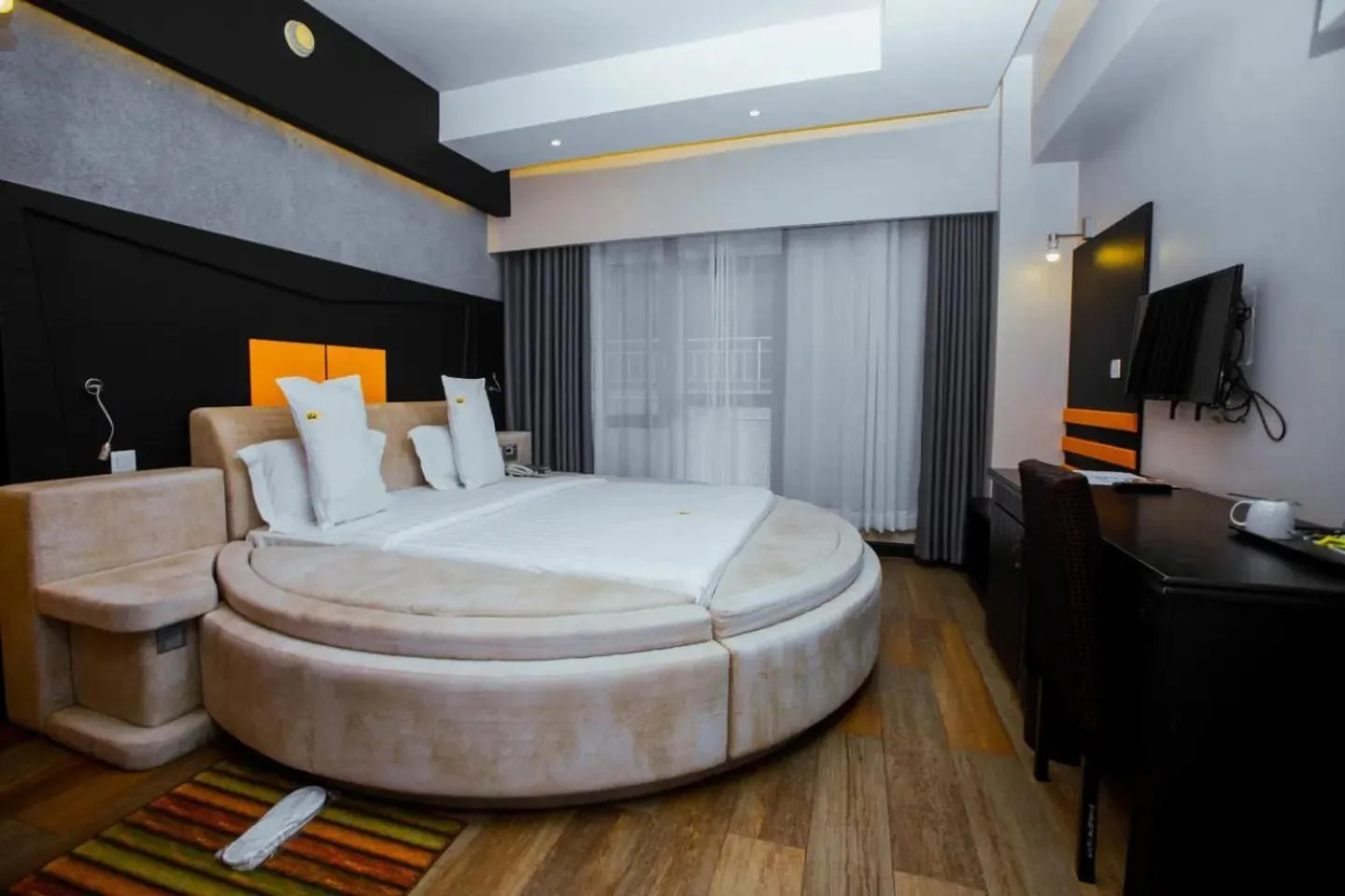 Communal lounge/ TV room, Bed in Gold Crest Hotel