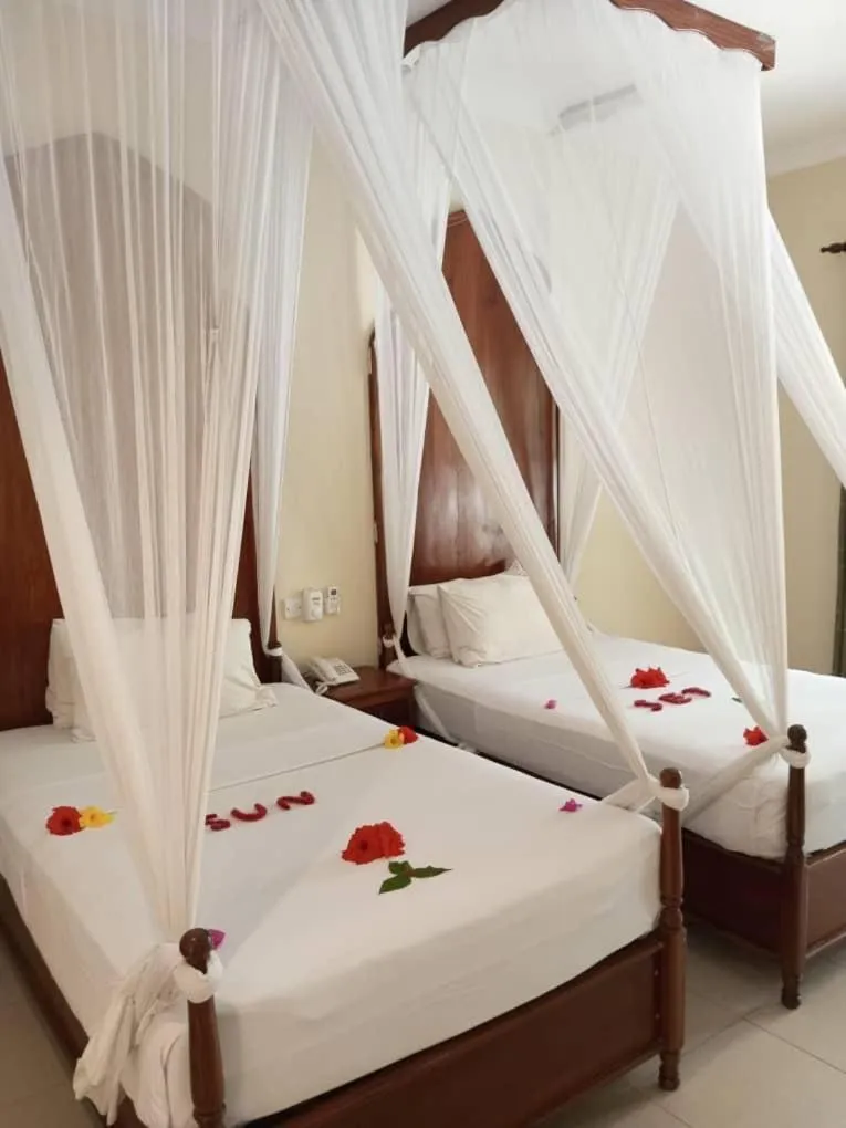 Bedroom, Bed in Sunset Kendwa Beach Hotel