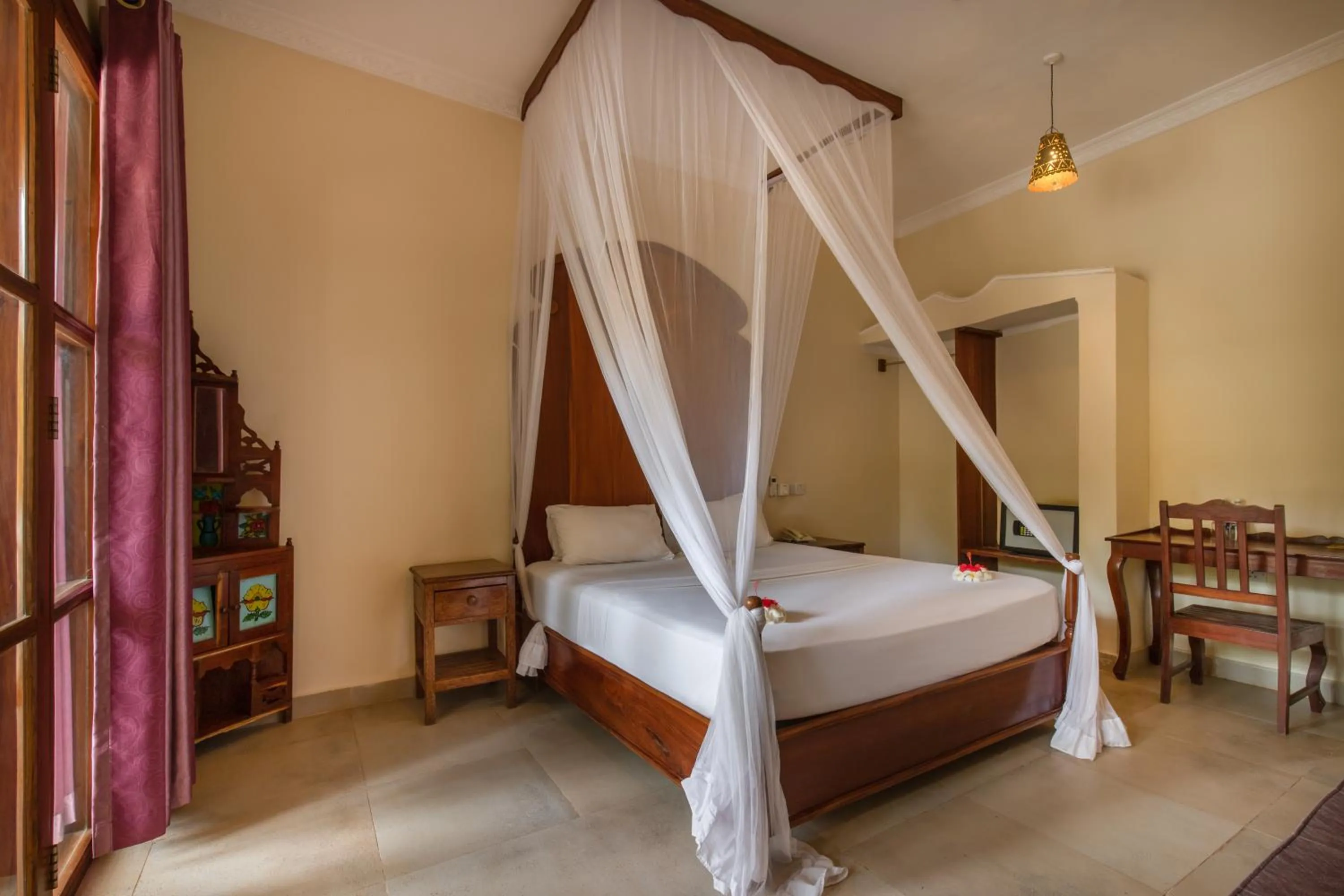 Bed in Sunset Kendwa Beach Hotel