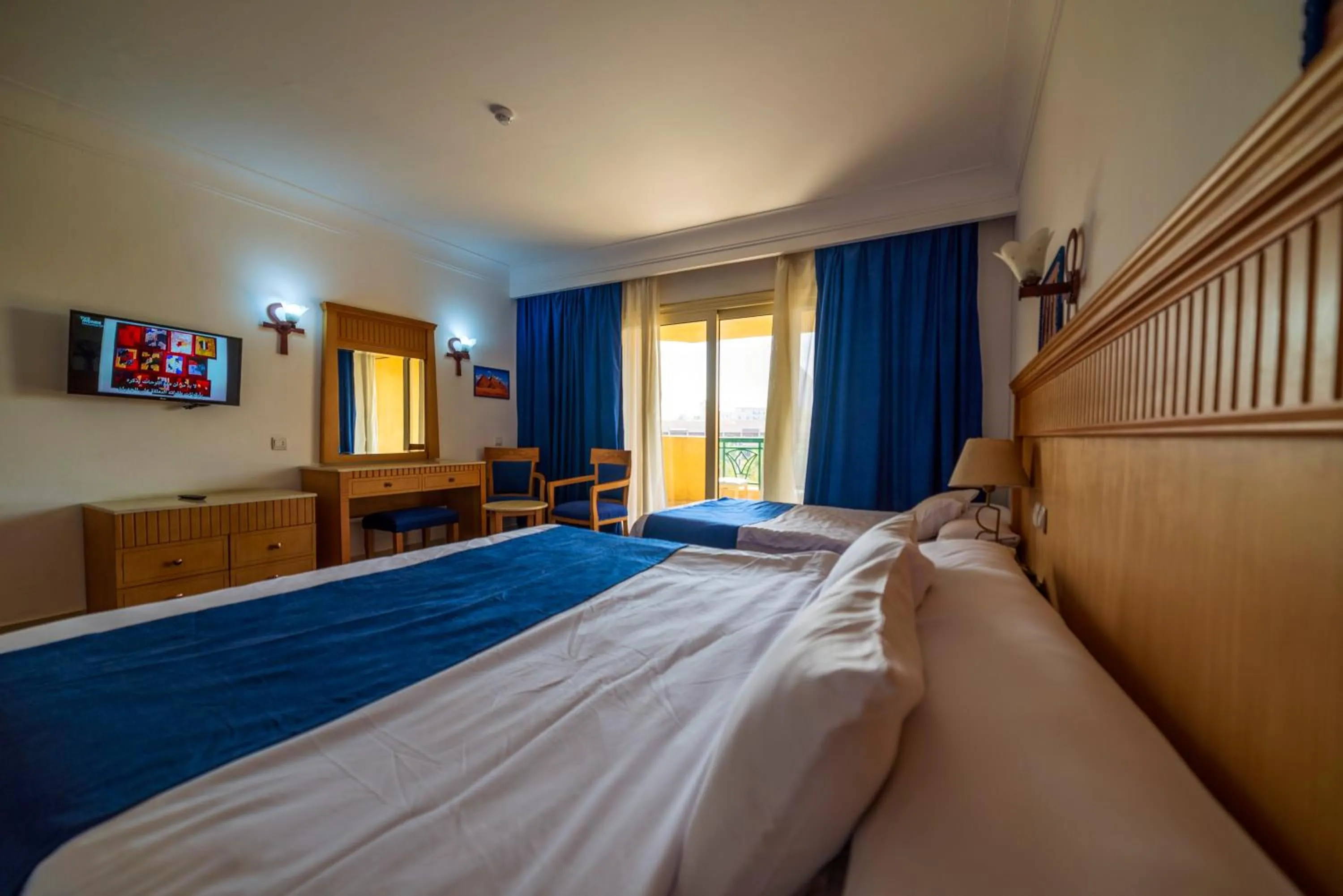 Bed in Regency Pyramids Hotel