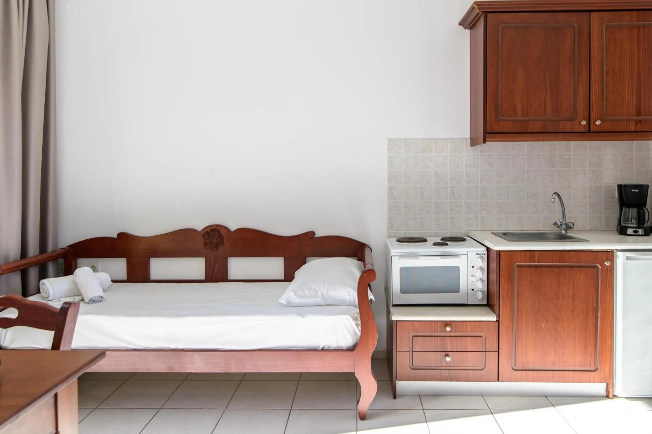 Bed in Ariadni Palace Apartments