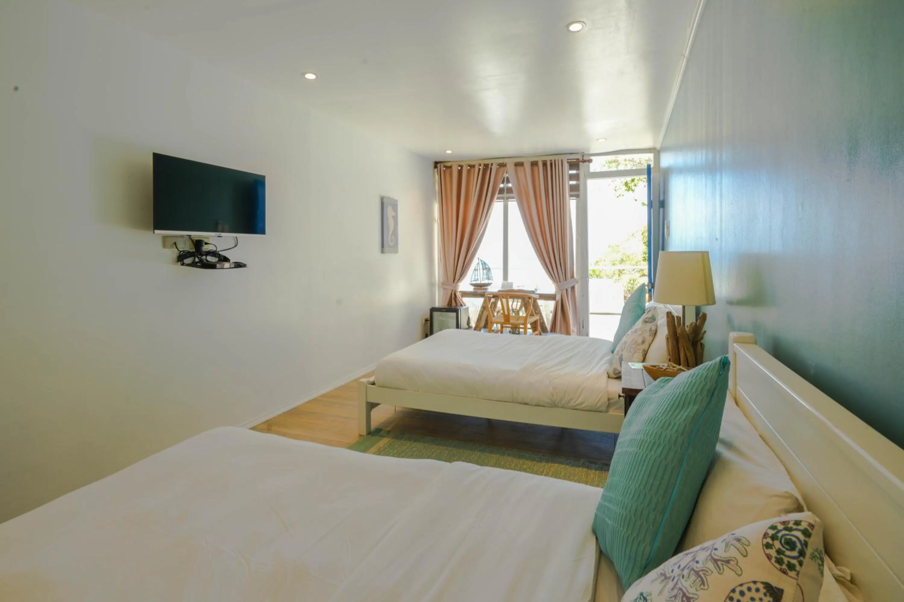 Bed in Destino Beach Resort and Hotel