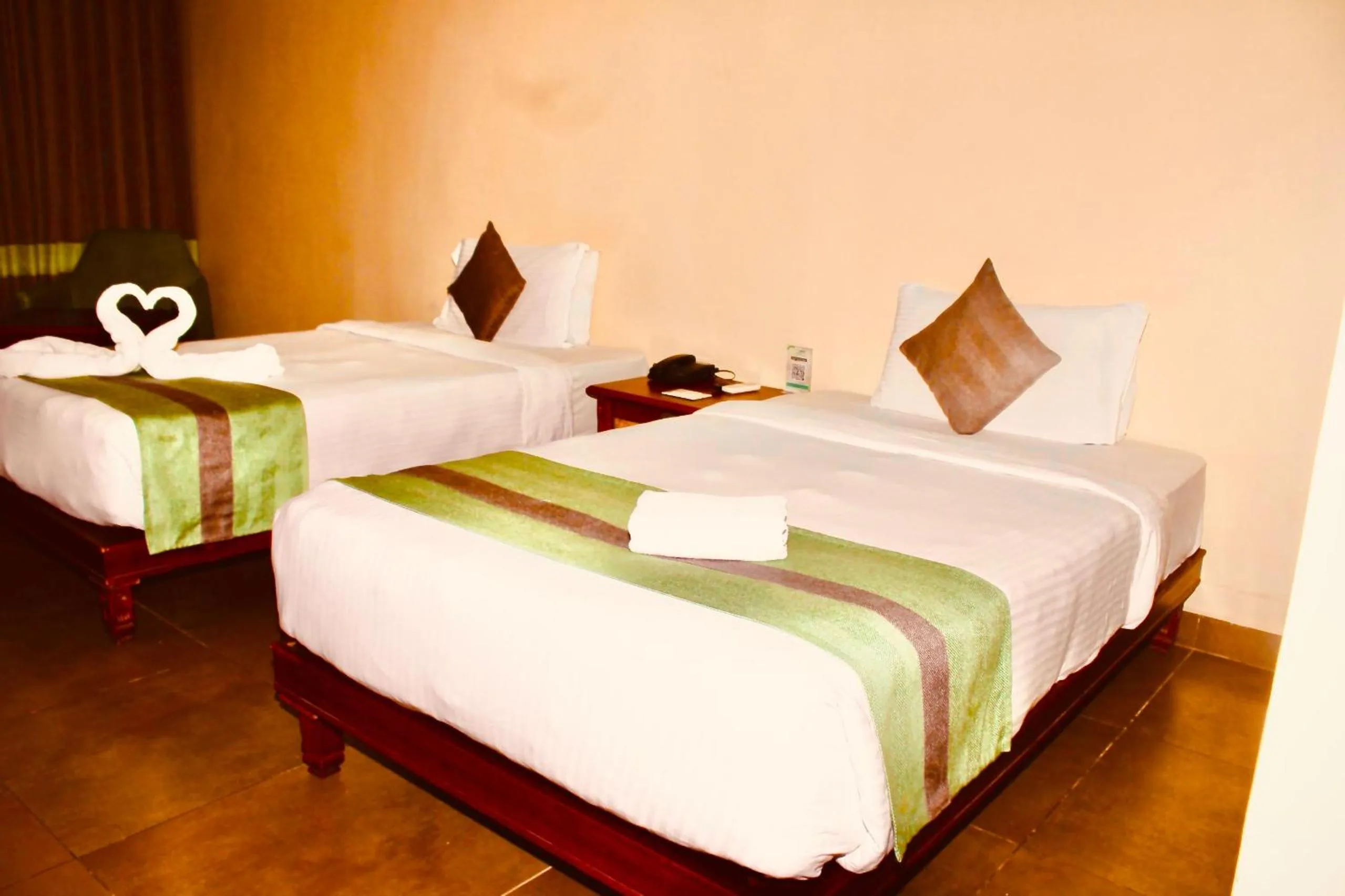 Bed in THE CENT HOTEL