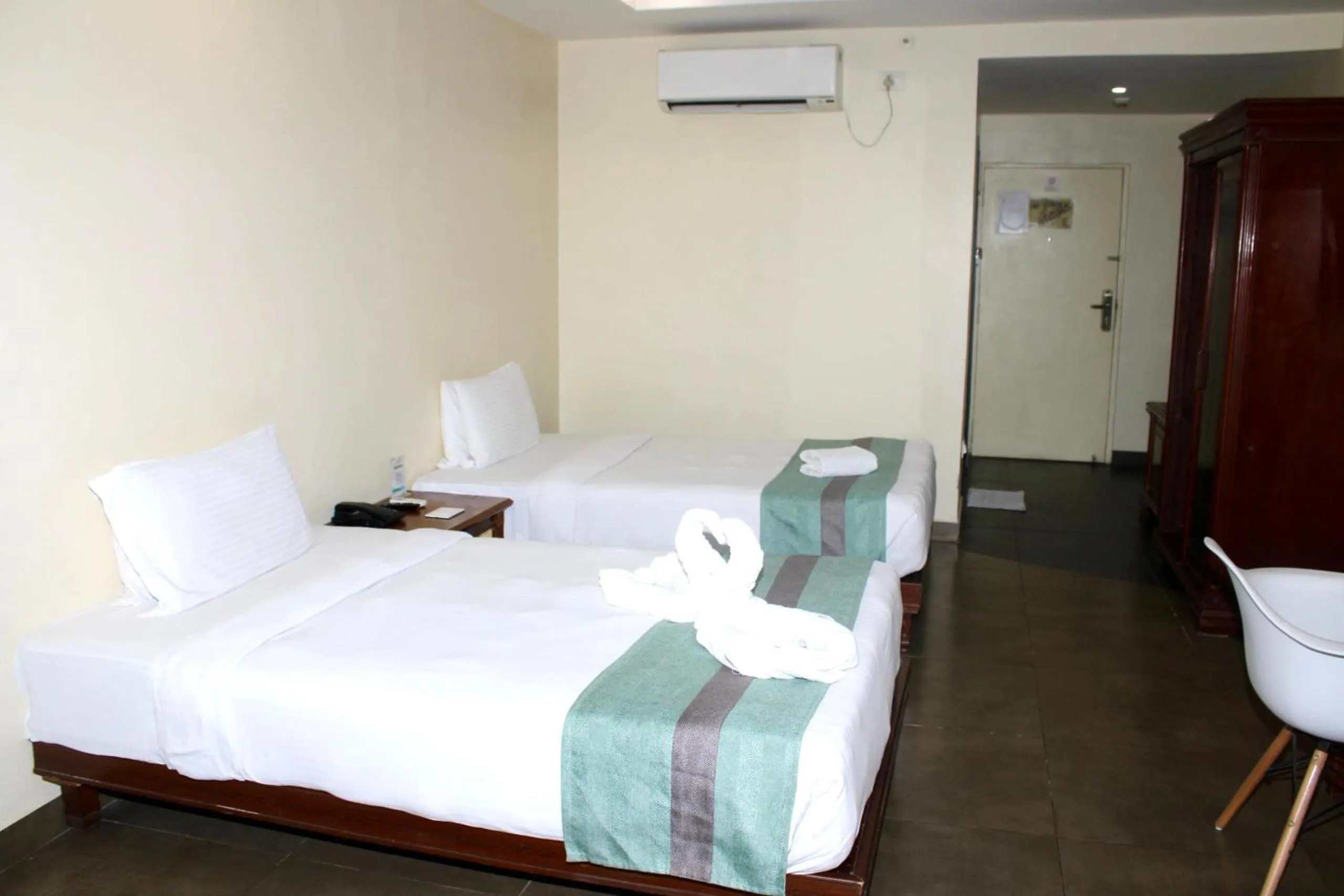 Bed in THE CENT HOTEL