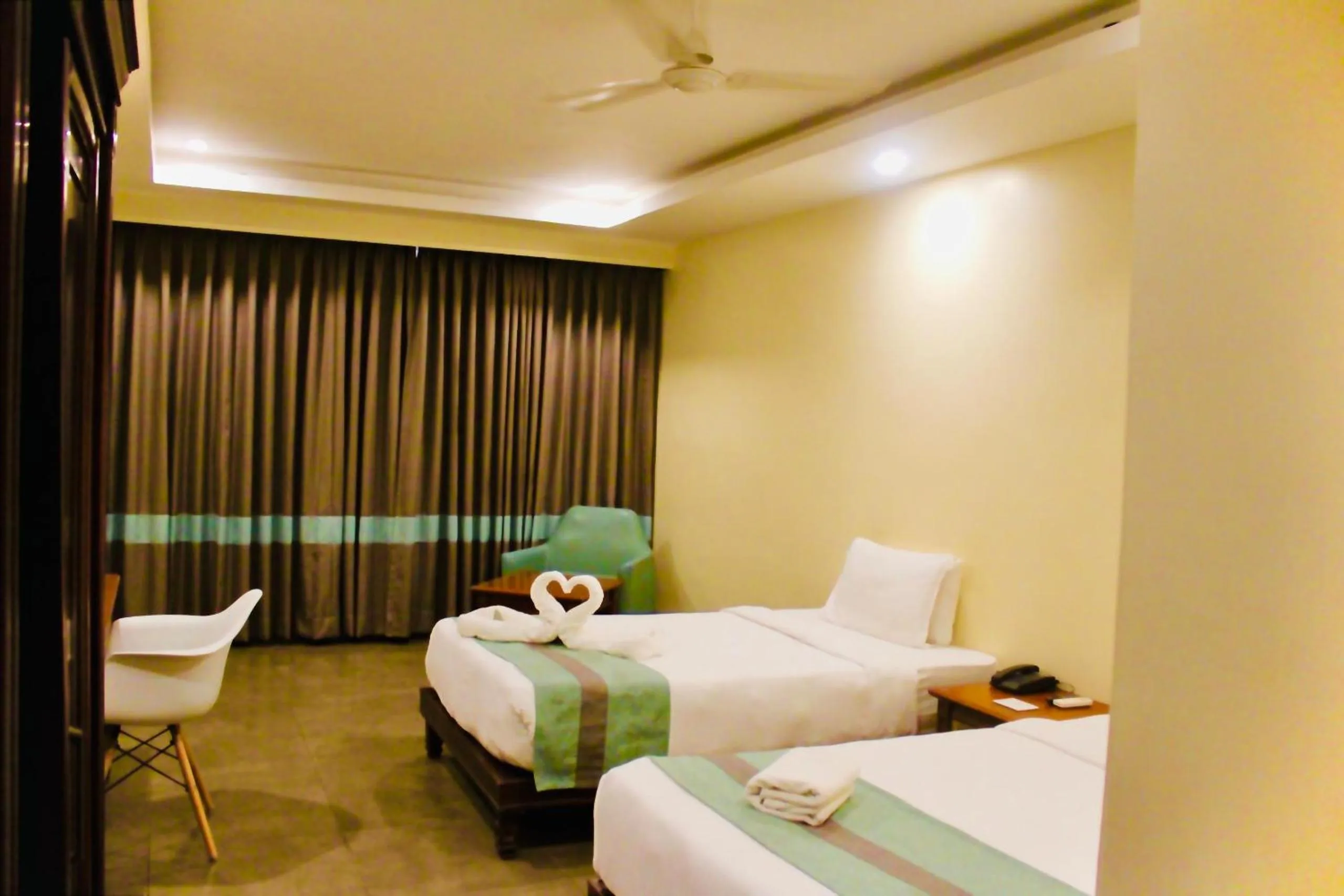 Bed in THE CENT HOTEL