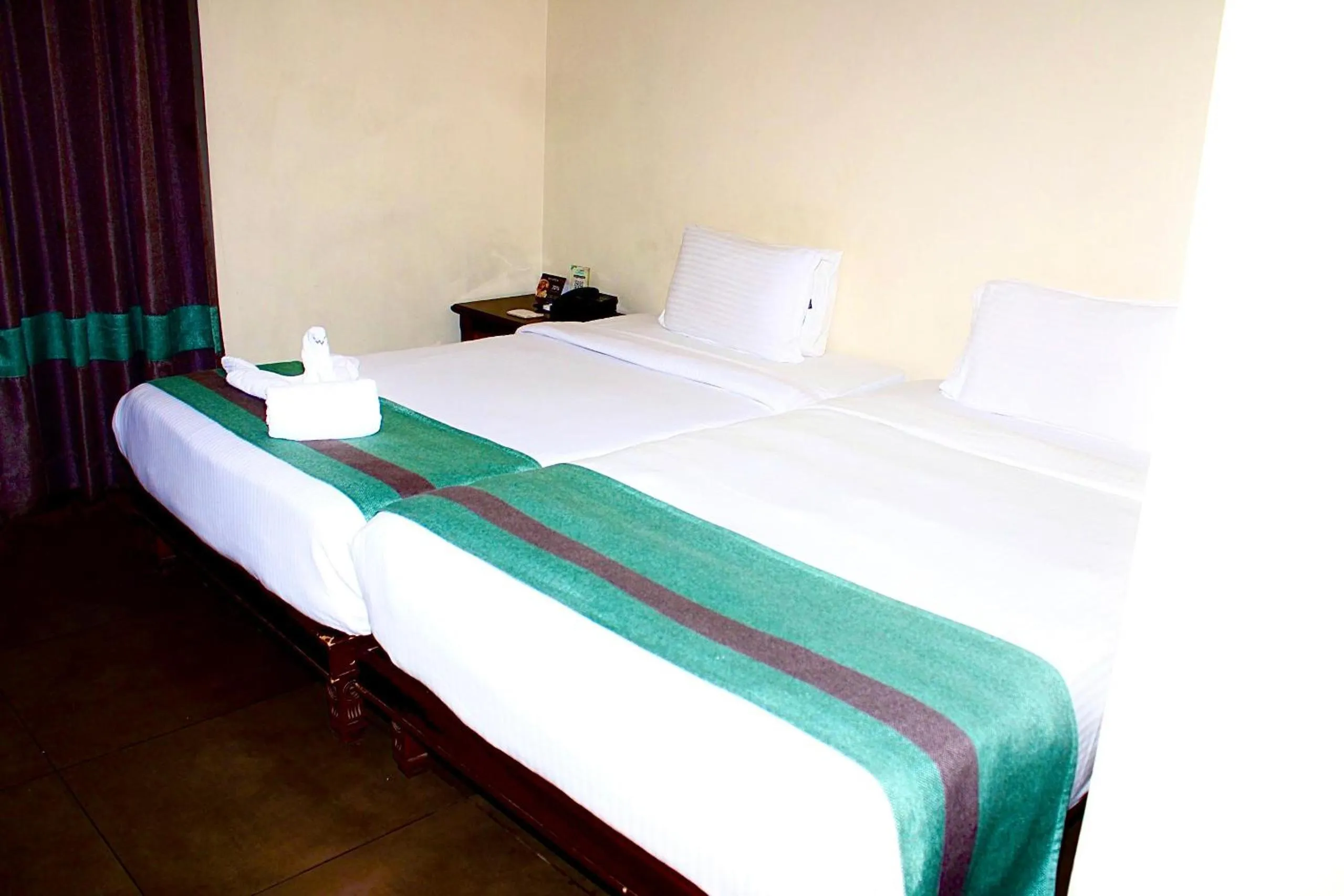 Bed in THE CENT HOTEL