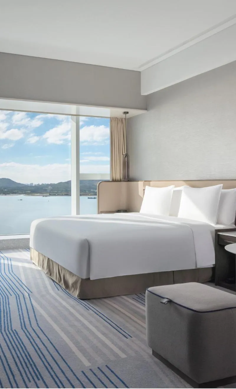 Bed in Crowne Plaza Xiamen Jimei Seaview by IHG-Free Mini Bar