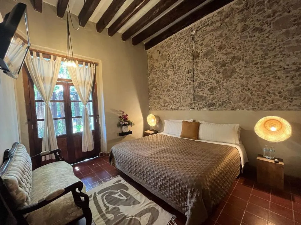 Bed in Posada Colibri - Hotel & Spa