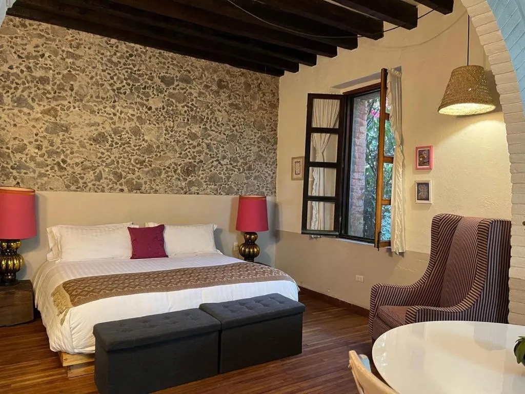 Bed in Posada Colibri - Hotel & Spa