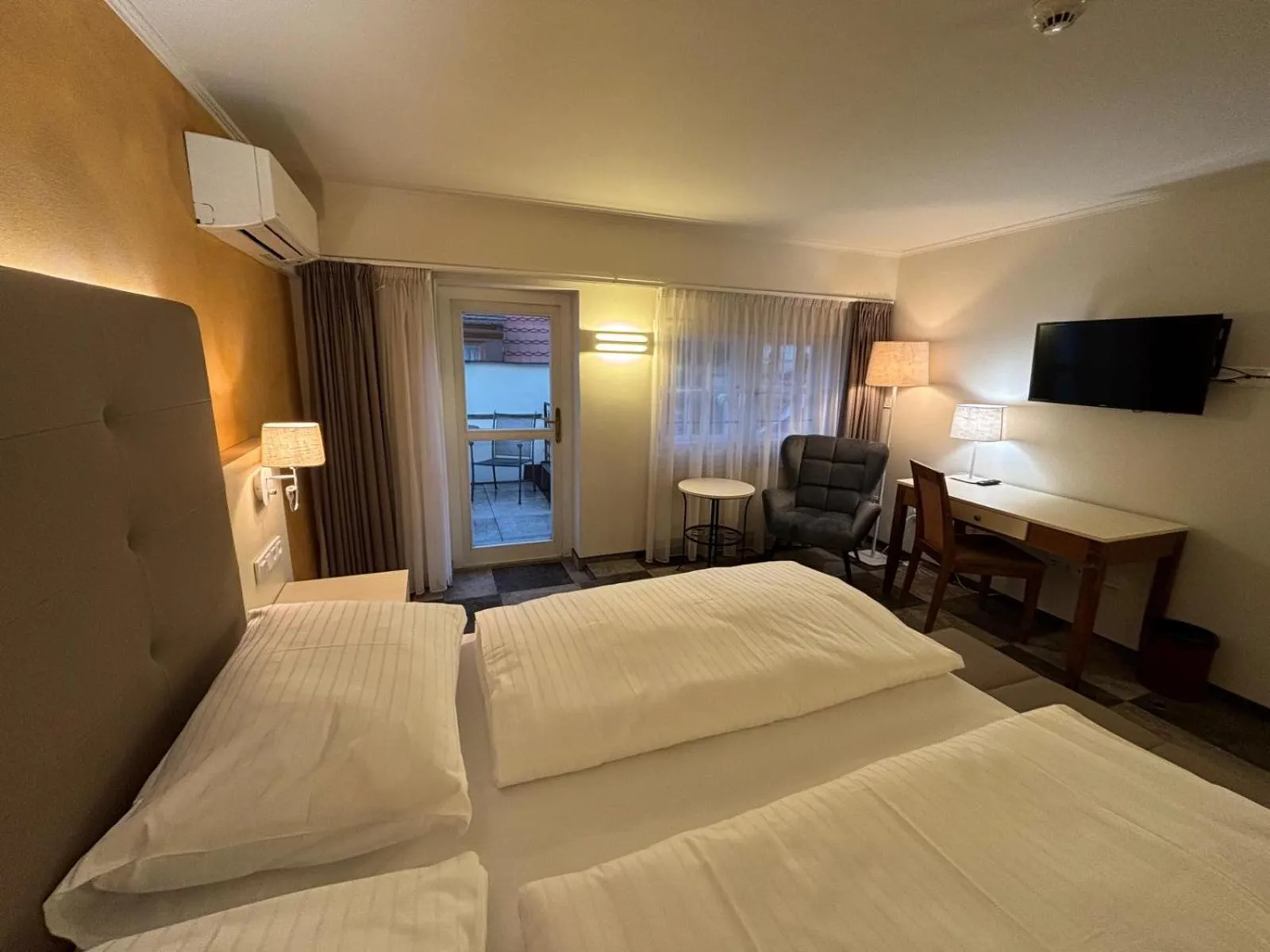 Bed in The Golden Wheel Hotel