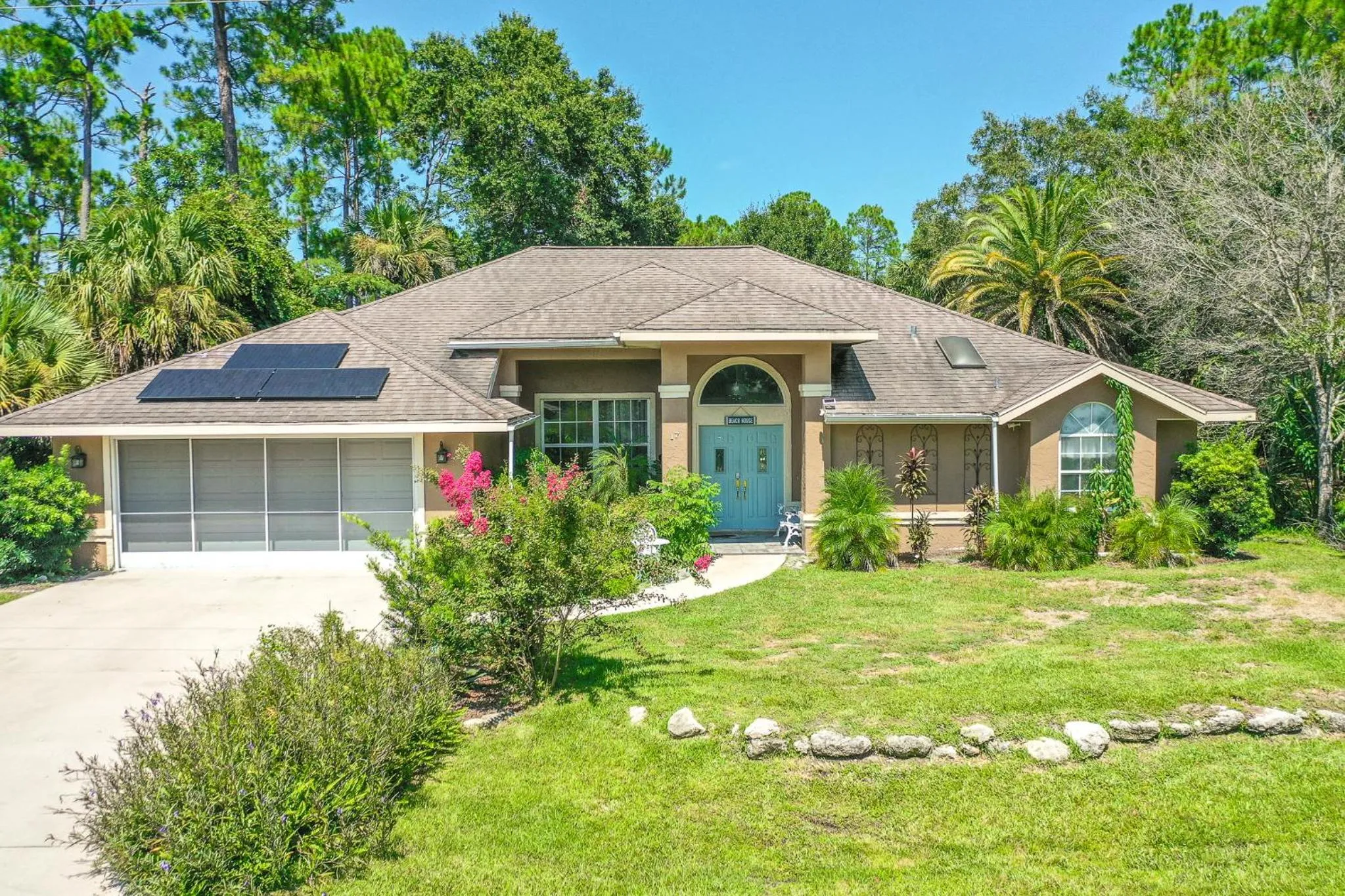 Patio in Tropical Escape with Relaxing Heated Pool & Palm Breezes
