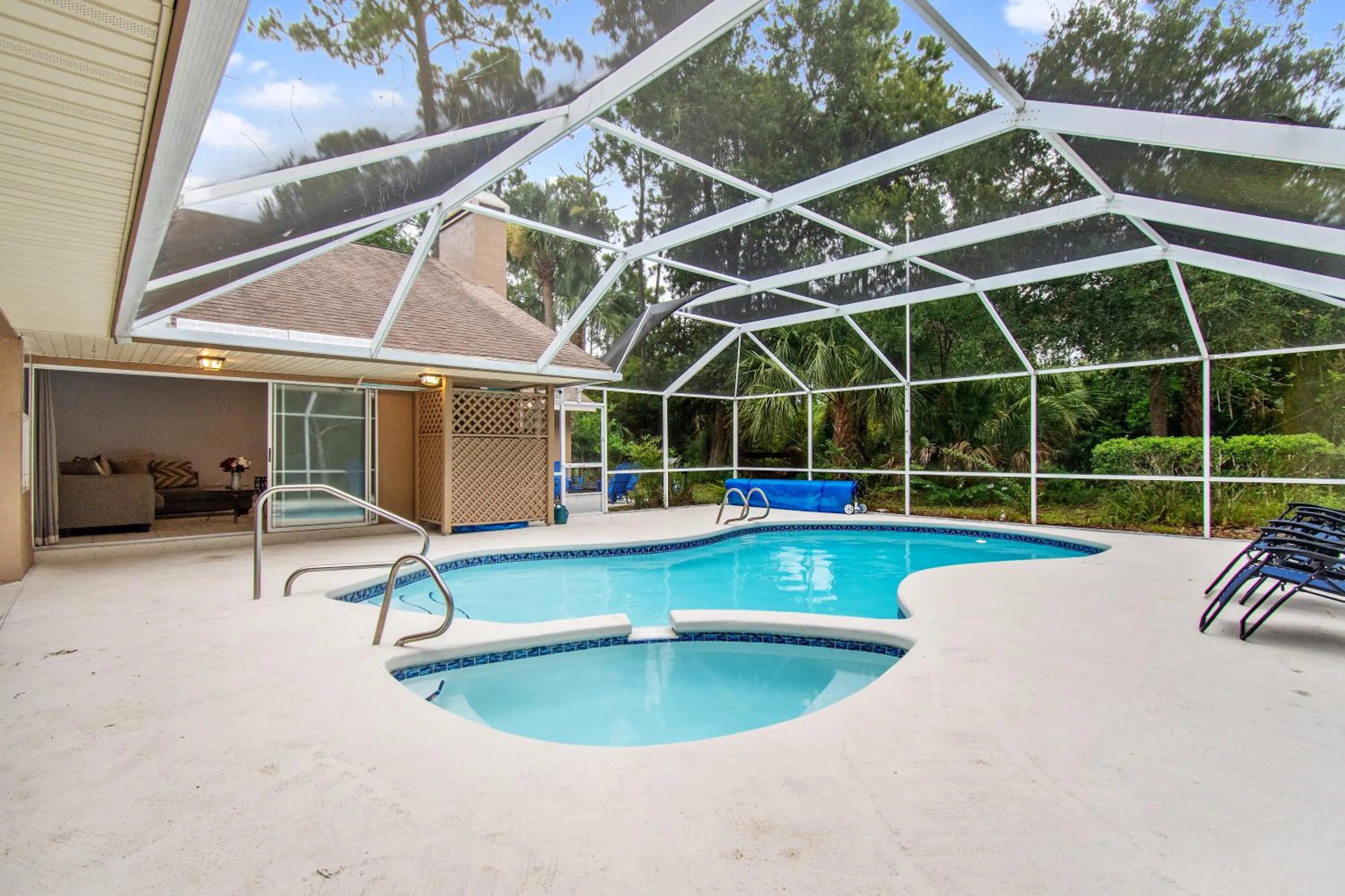 Pool view in Tropical Escape with Relaxing Heated Pool & Palm Breezes