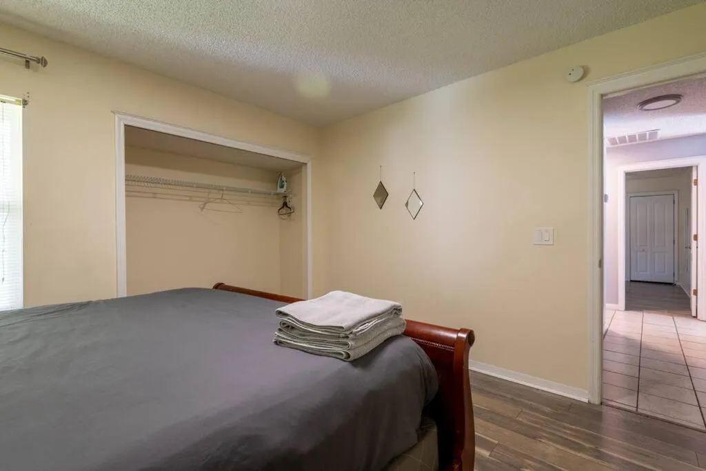 Bed in Tropical Escape with Relaxing Heated Pool & Palm Breezes