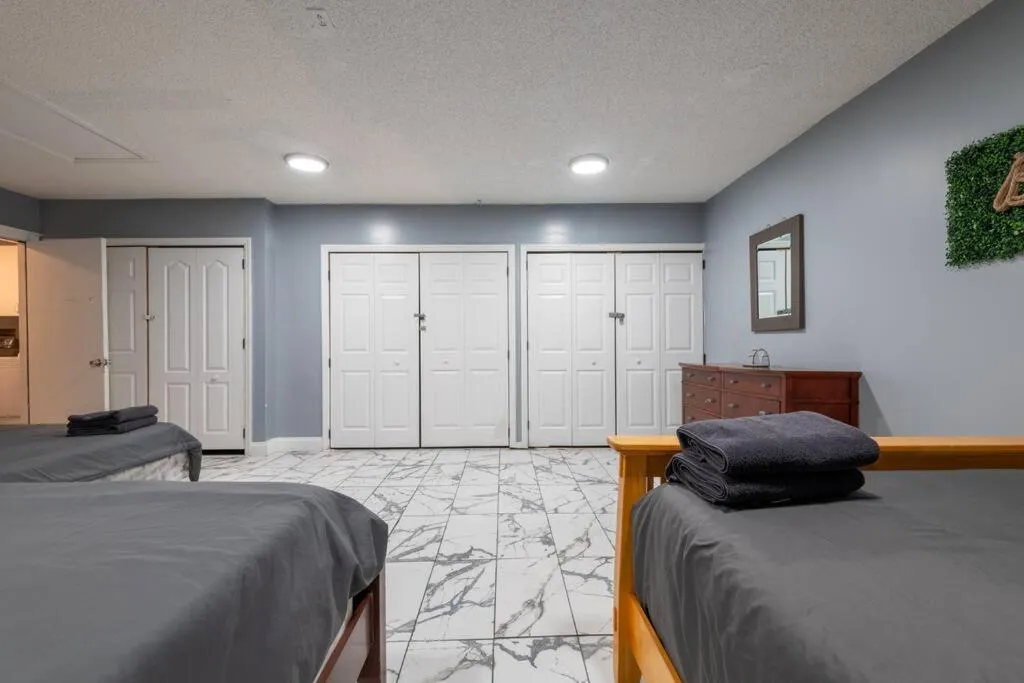 Bed in Tropical Escape with Relaxing Heated Pool & Palm Breezes