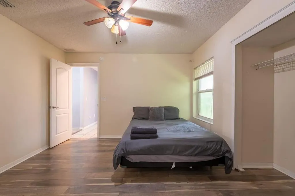 Bed in Tropical Escape with Relaxing Heated Pool & Palm Breezes