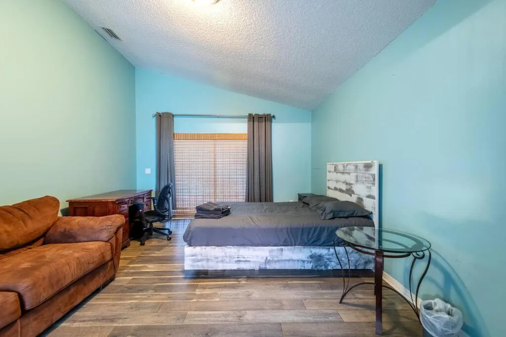 Bed in Tropical Escape with Relaxing Heated Pool & Palm Breezes