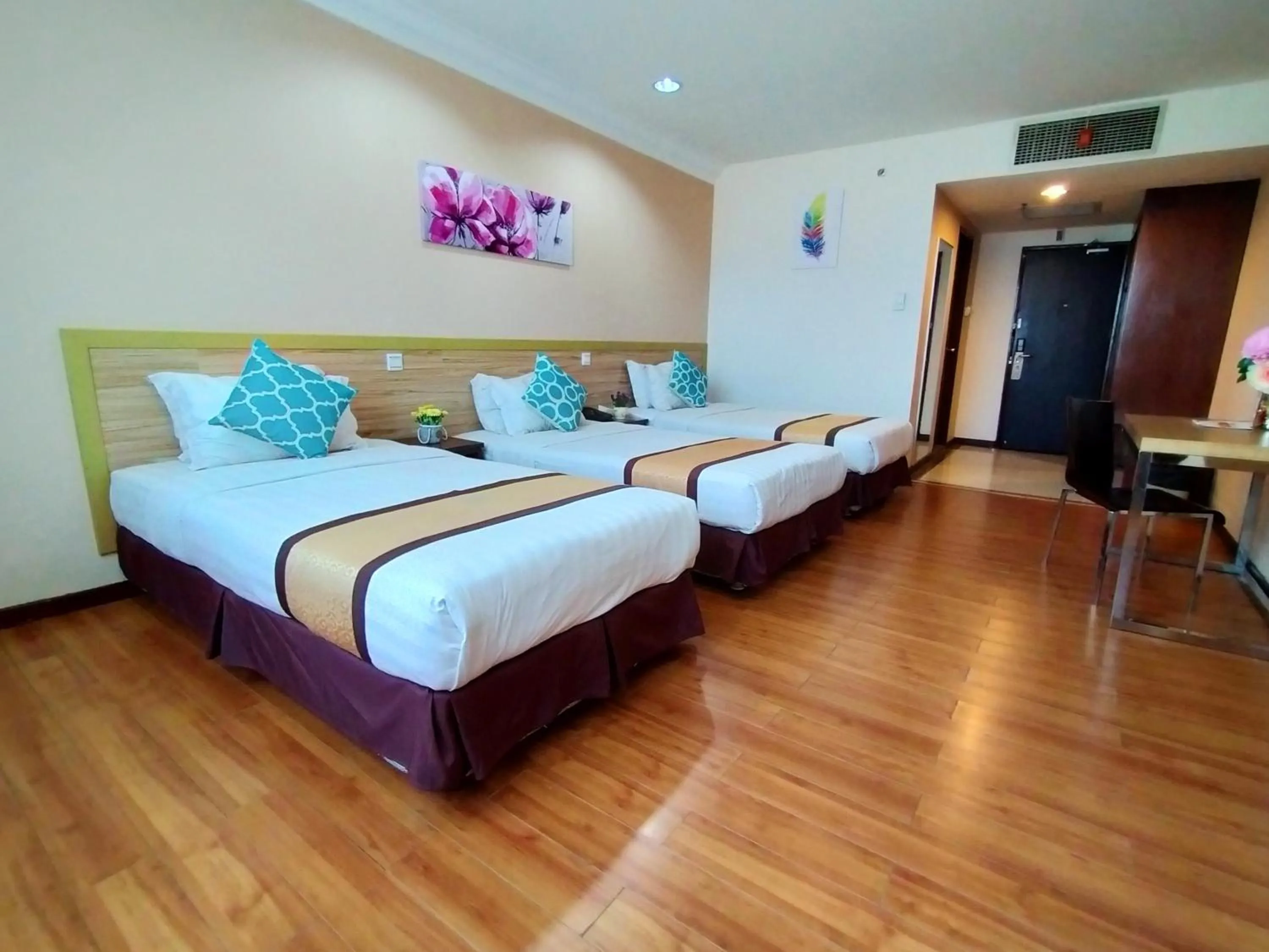 Bed in TD Plaza Hotel