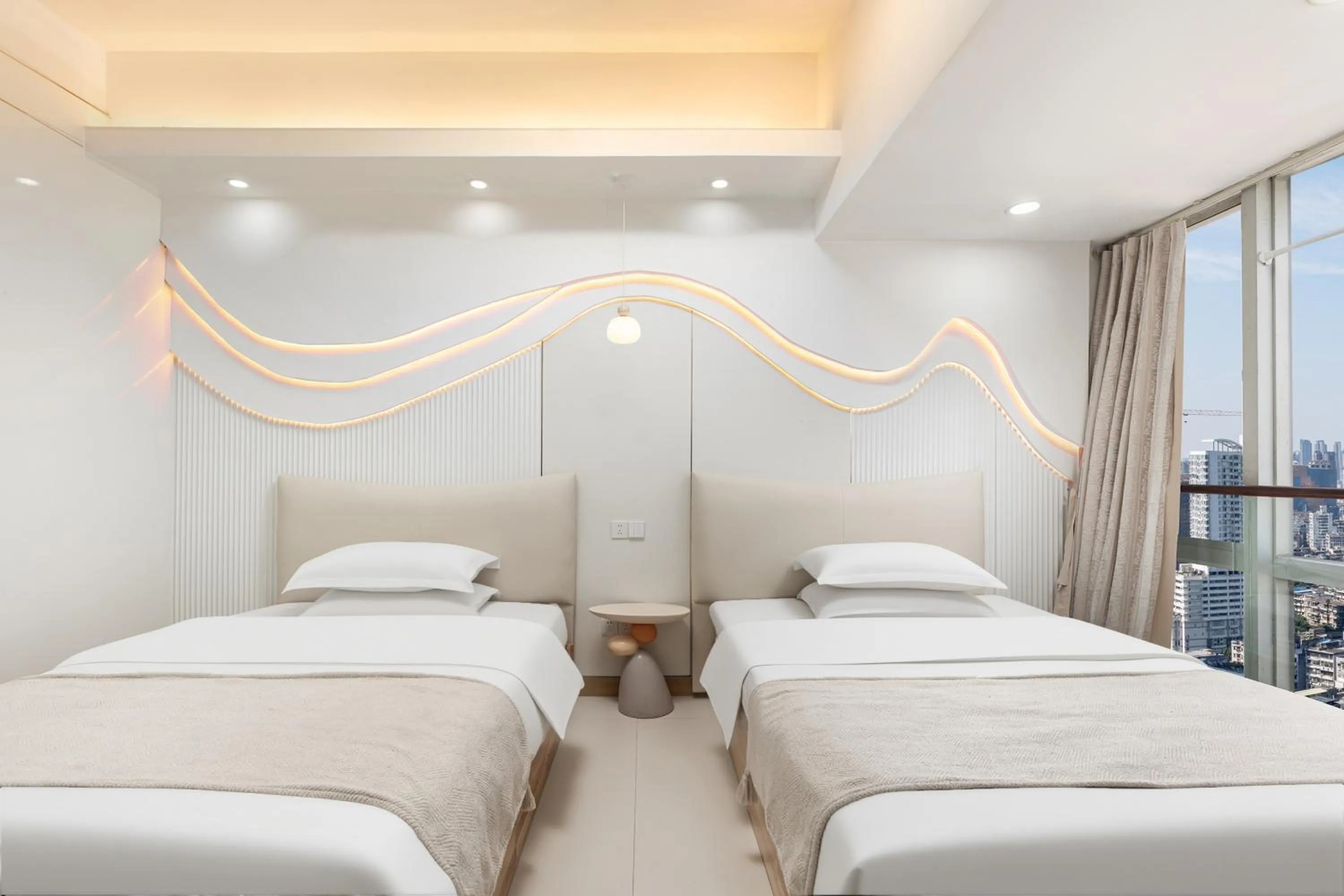 Bed in Grand Continental Apartment