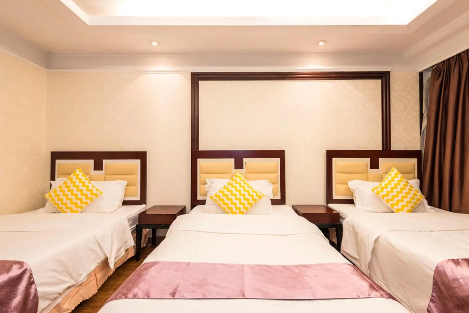 Bed in Grand Continental Apartment