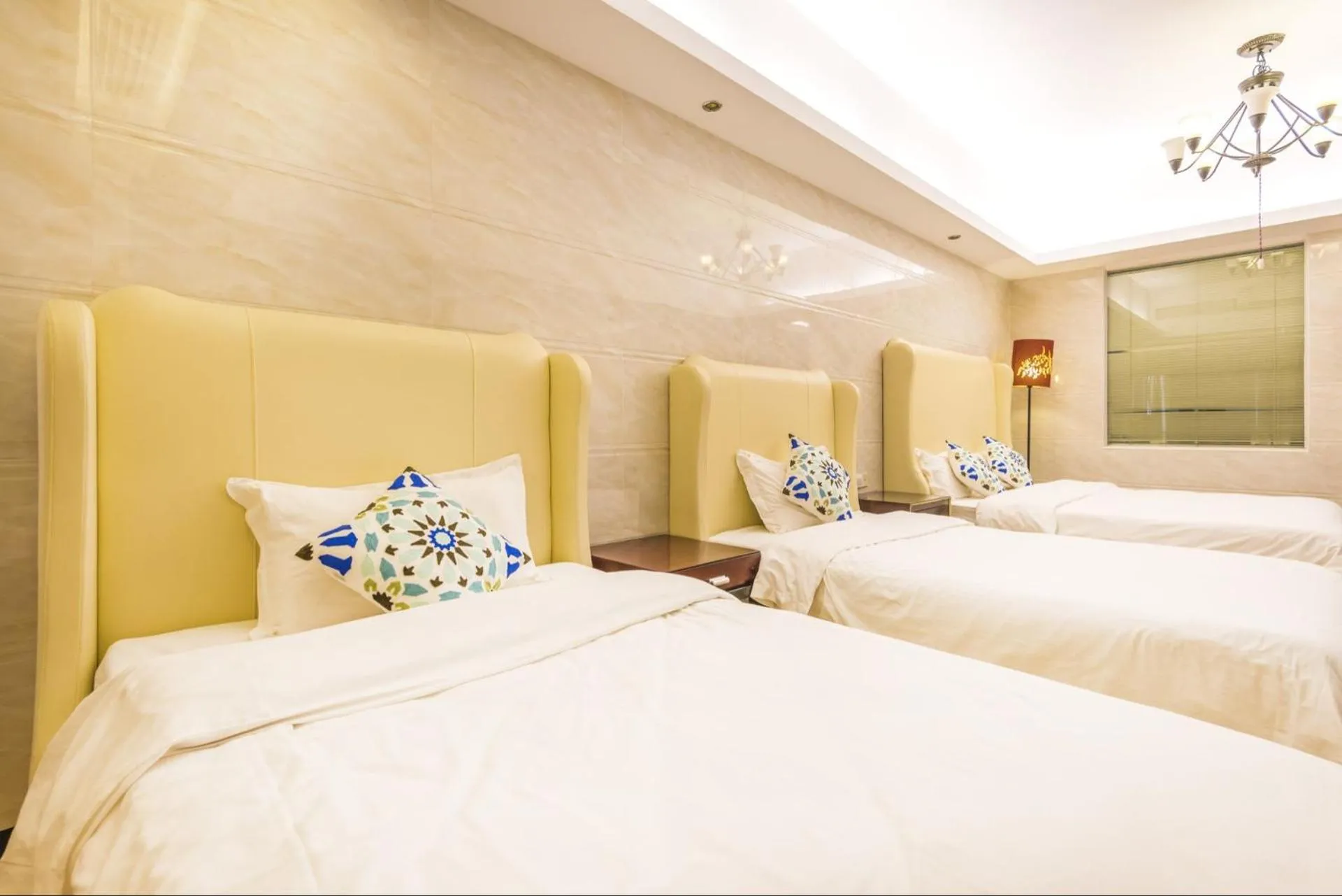 Bed in Grand Continental Apartment