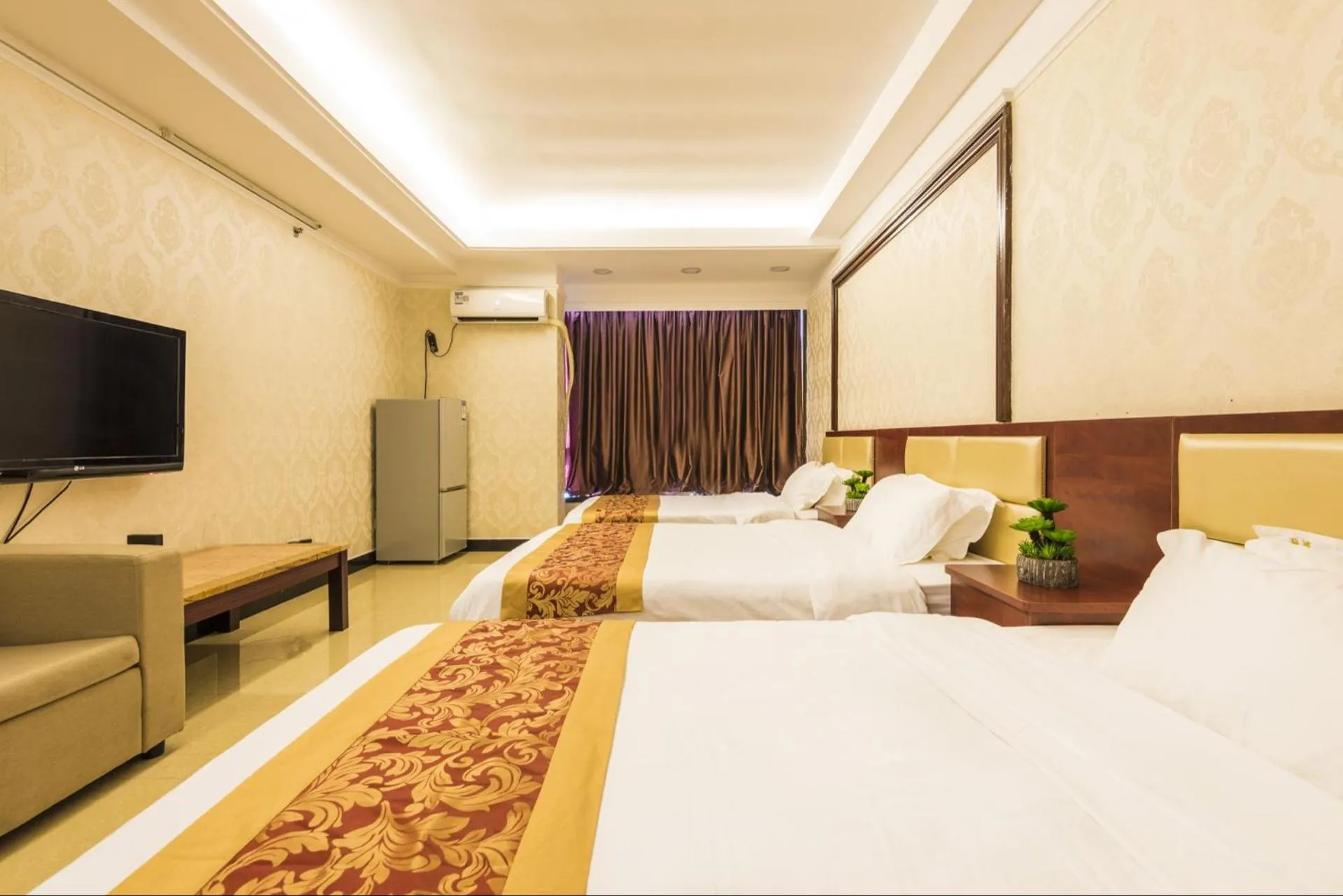 Bed in Grand Continental Apartment