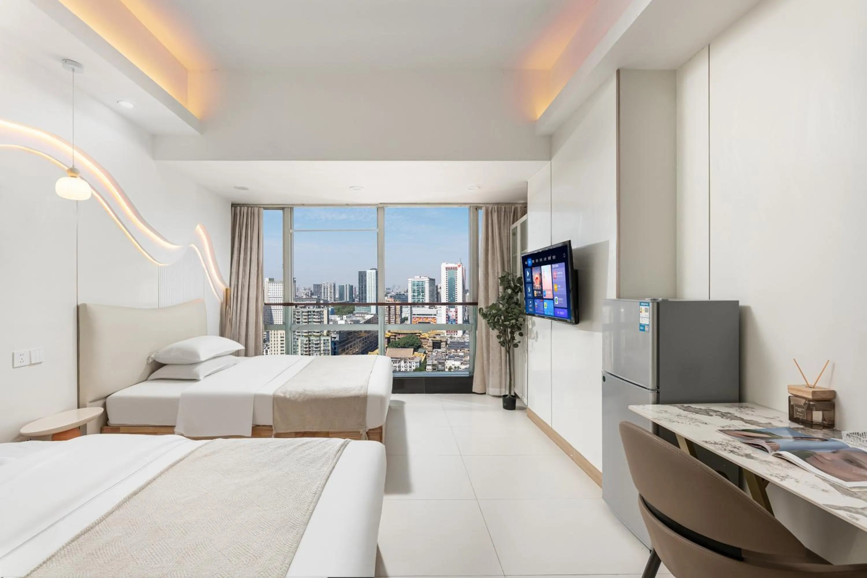 Bed in Grand Continental Apartment