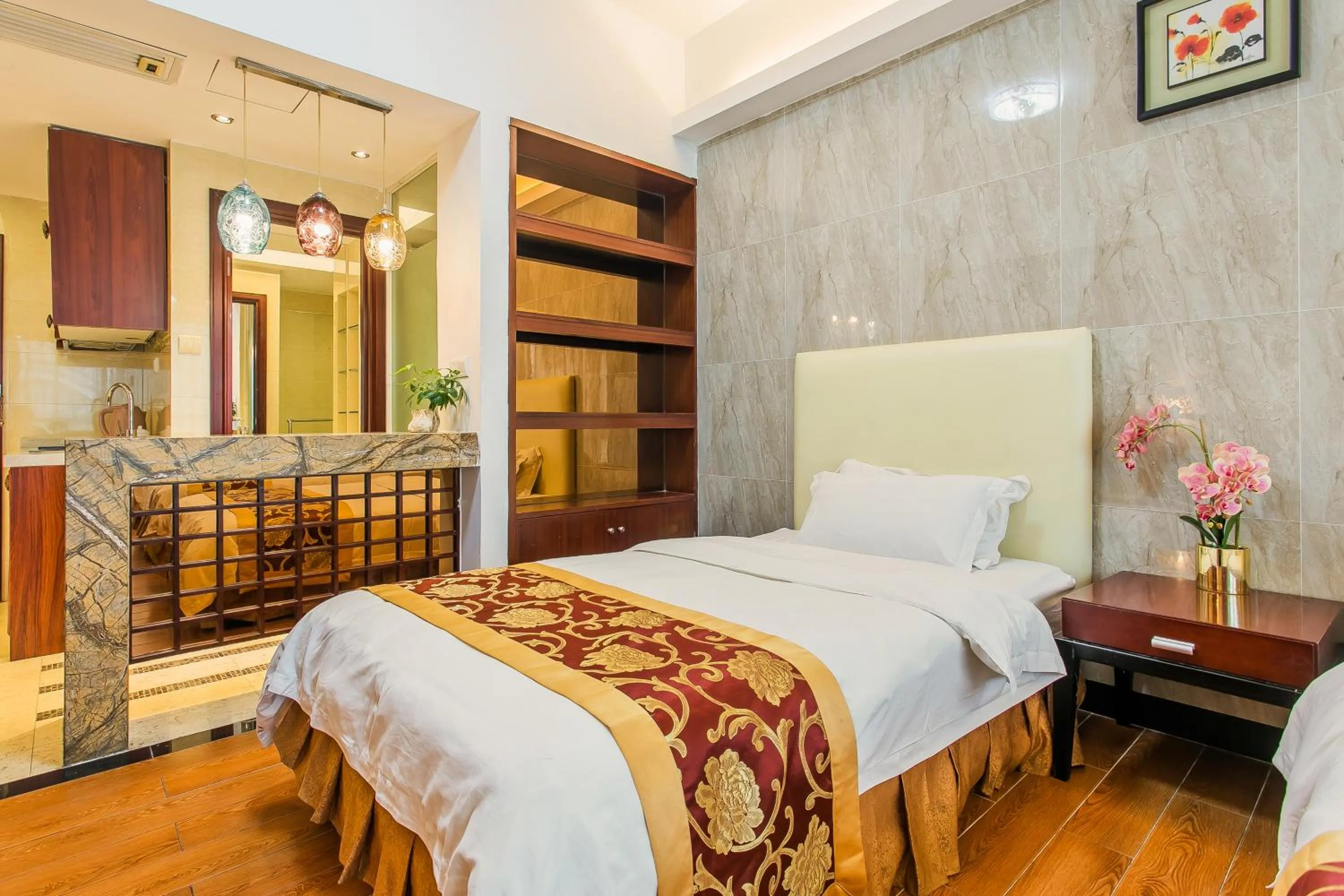 Bed in Grand Continental Apartment