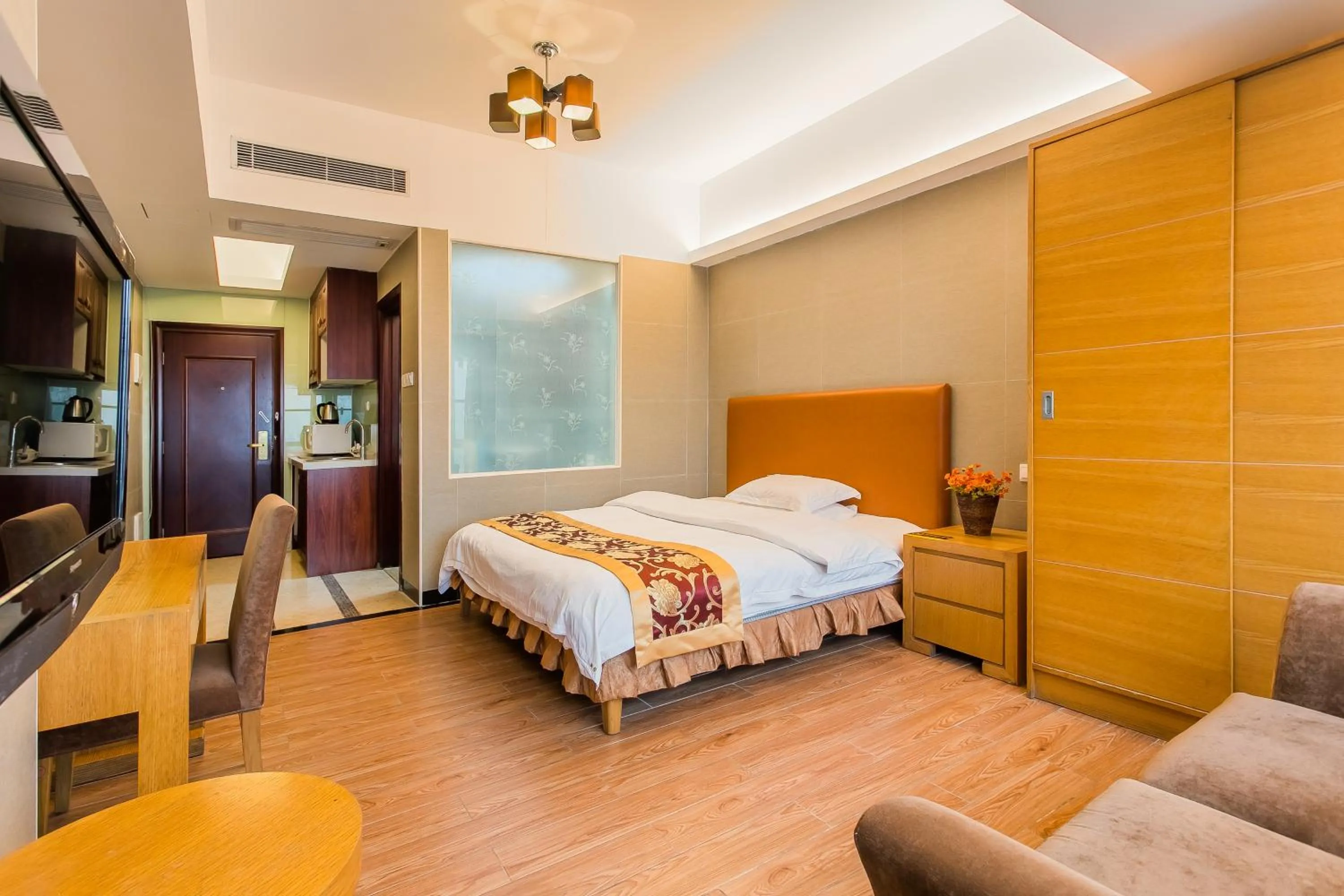 Bed in Grand Continental Apartment