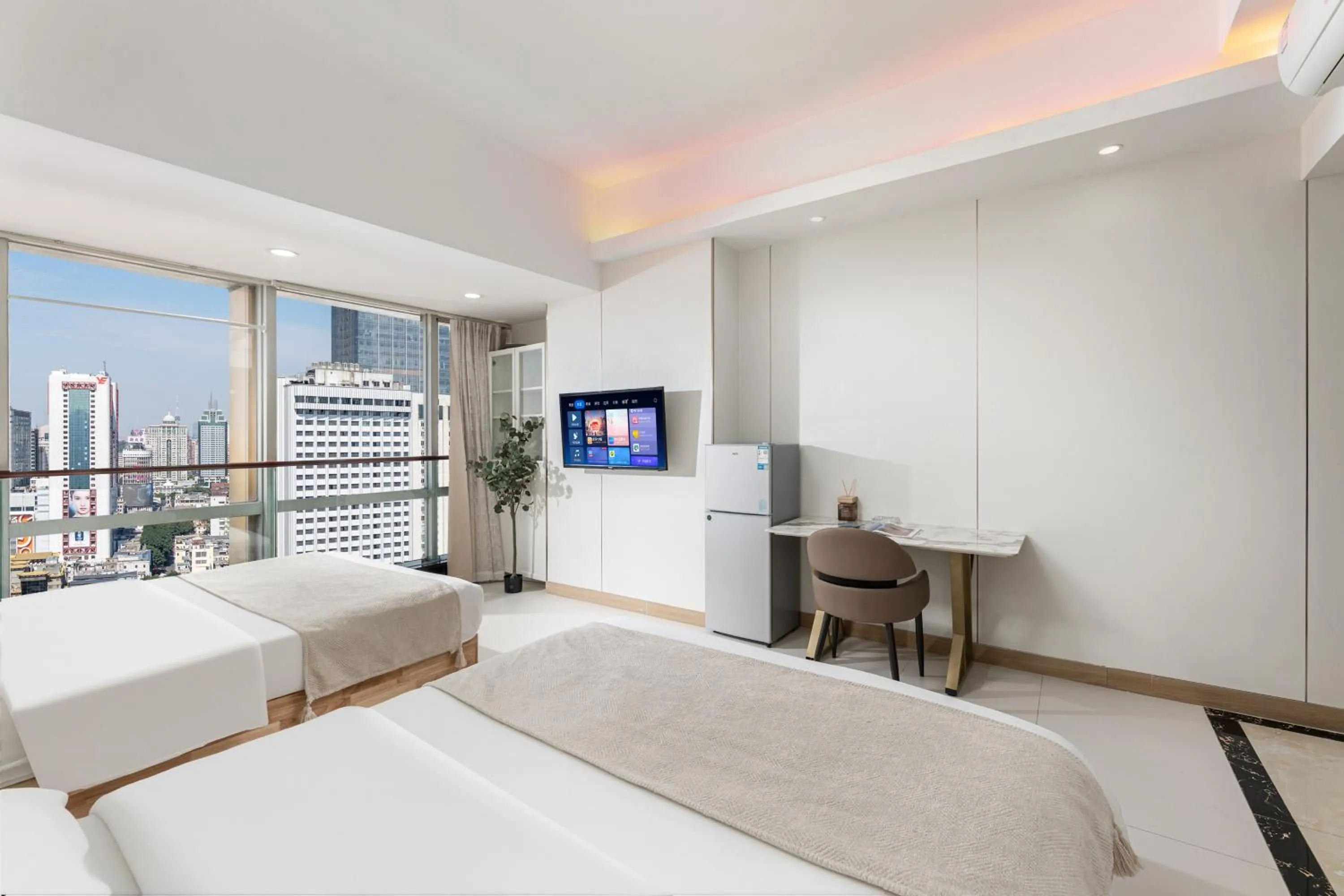 Bed in Grand Continental Apartment