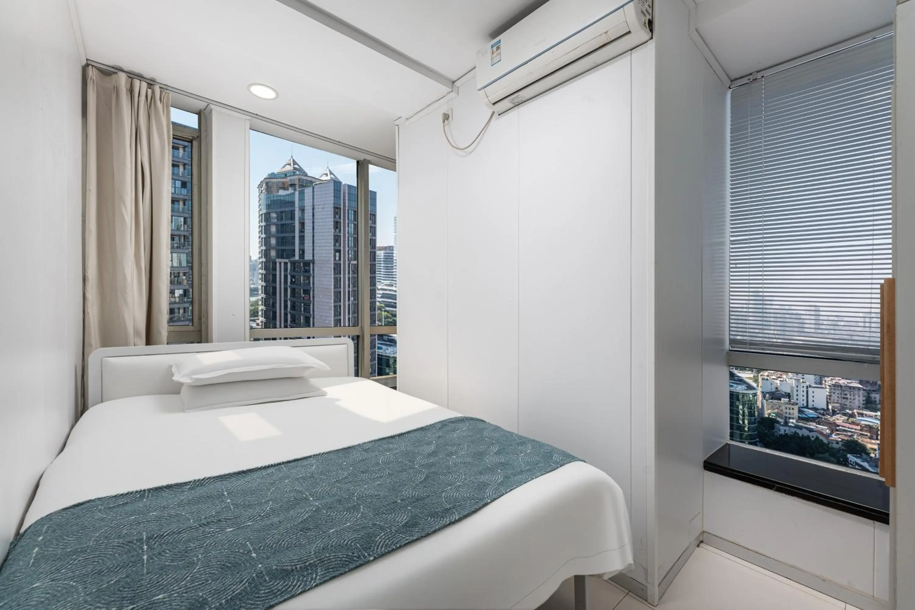 Bed in Grand Continental Apartment