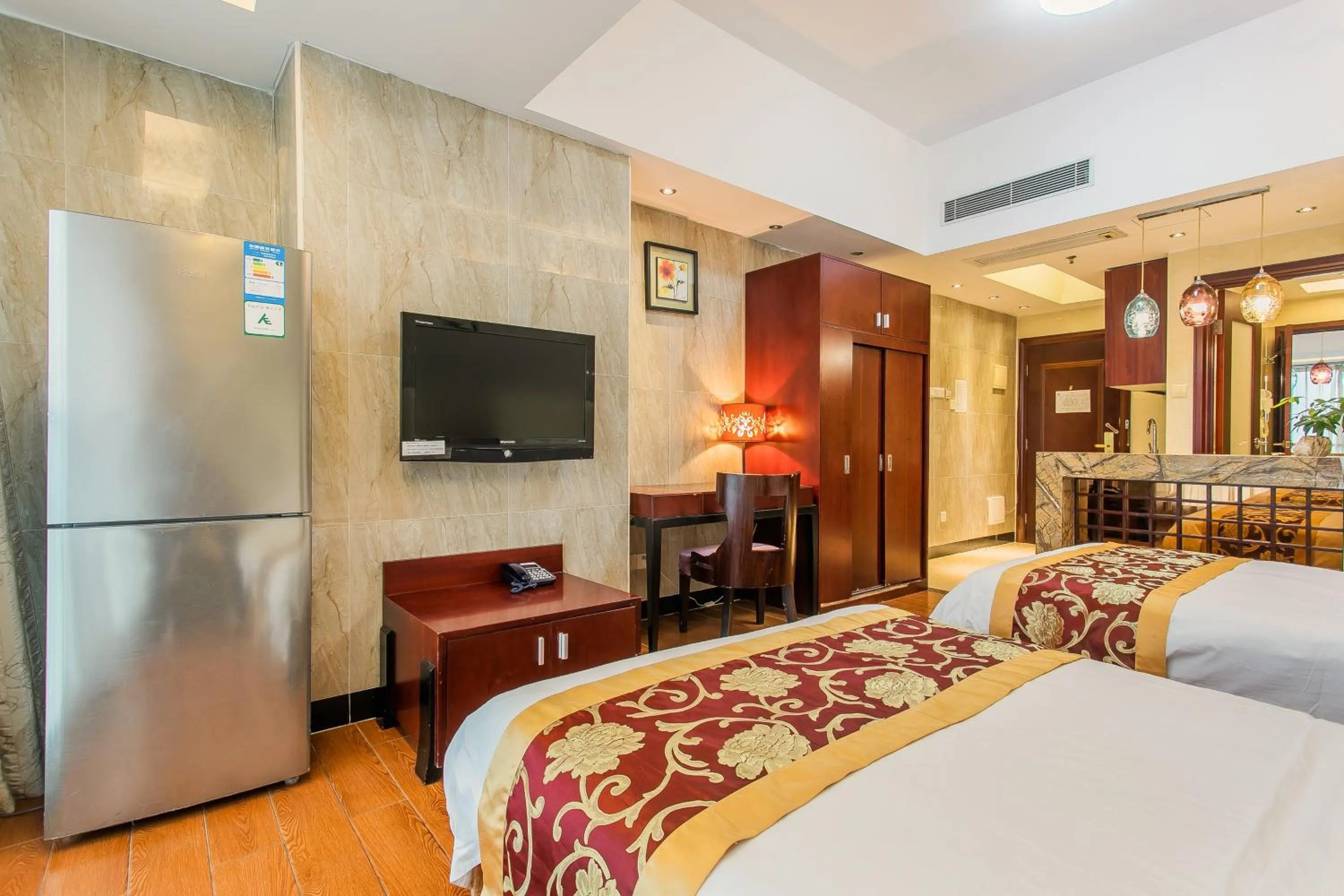 Bed in Grand Continental Apartment