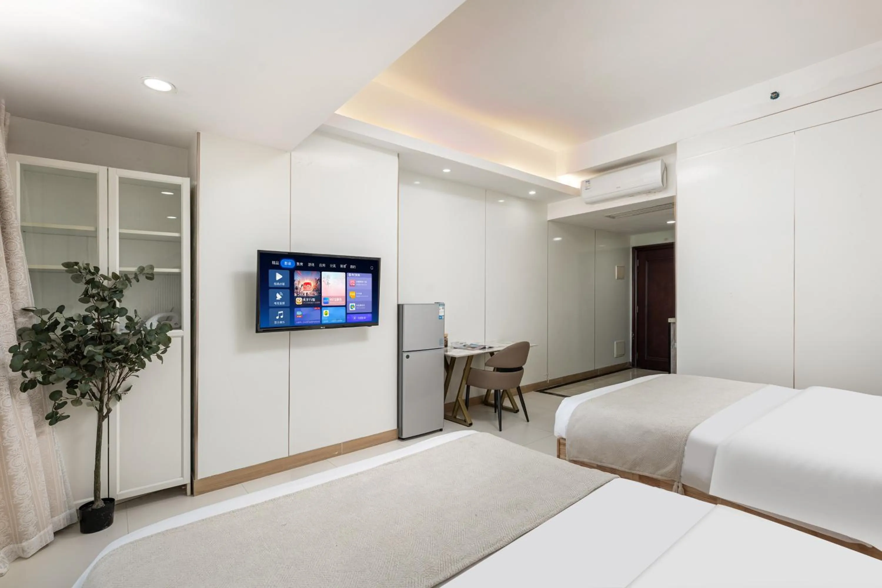 Bed in Grand Continental Apartment