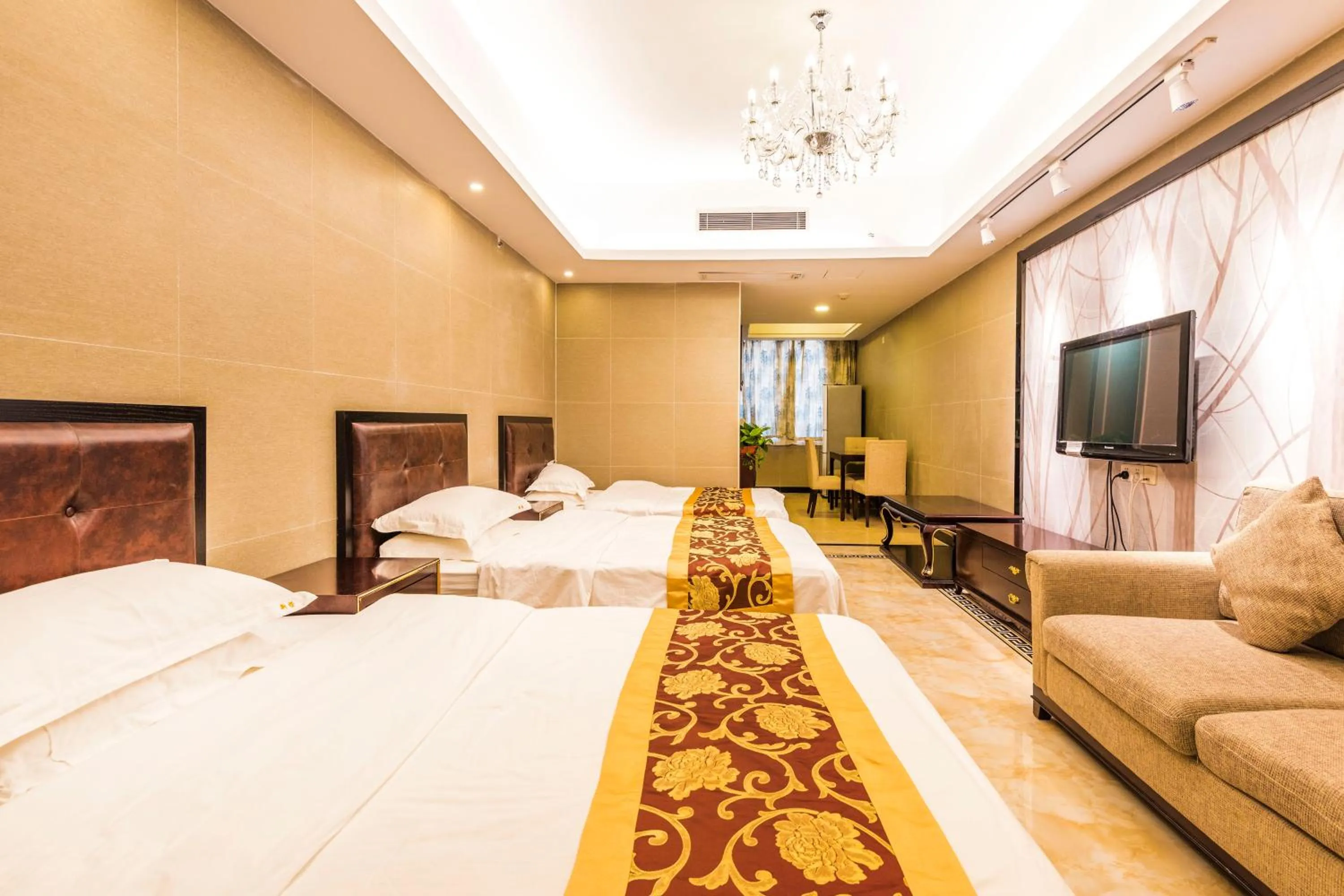 Bed in Grand Continental Apartment