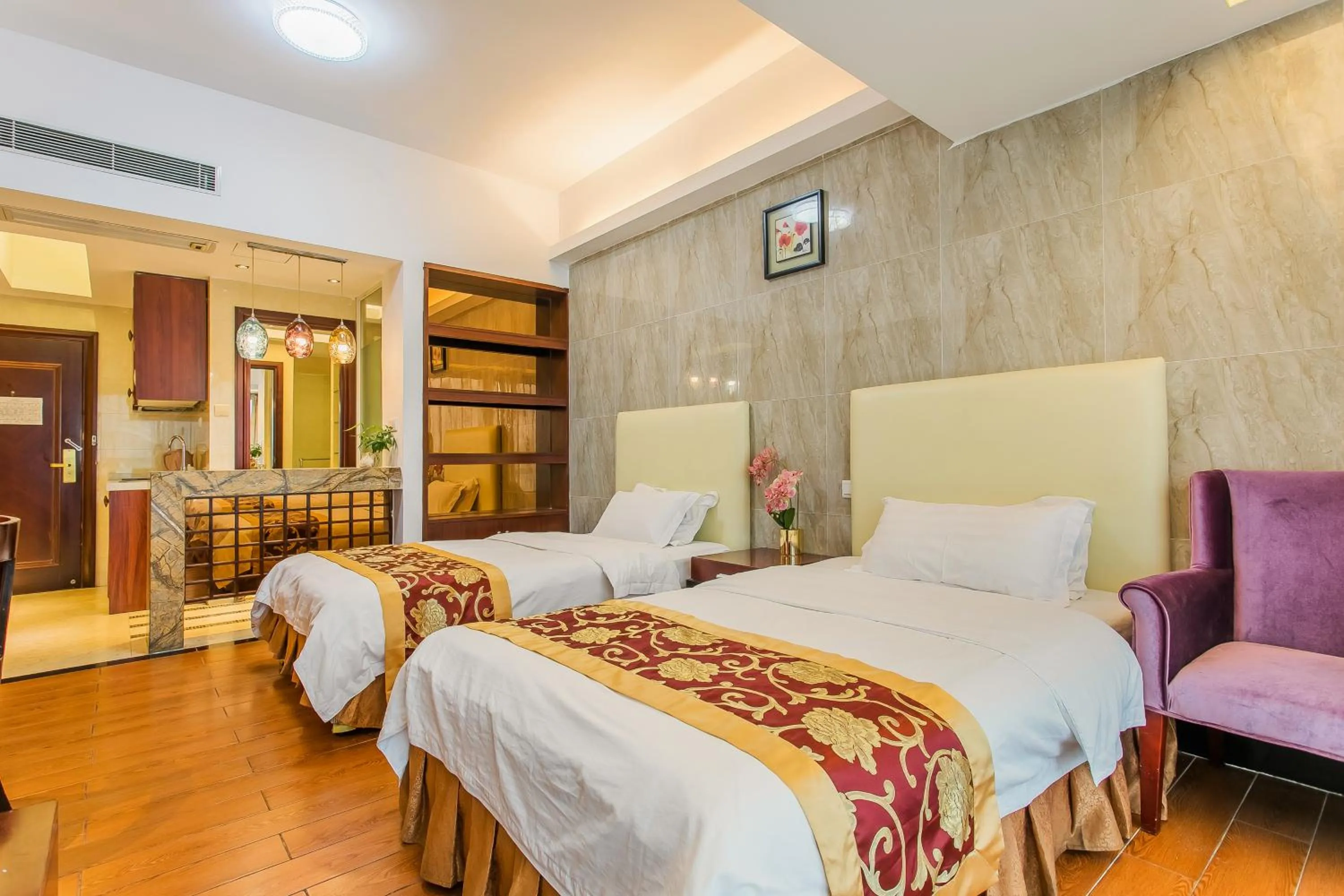 Bed in Grand Continental Apartment