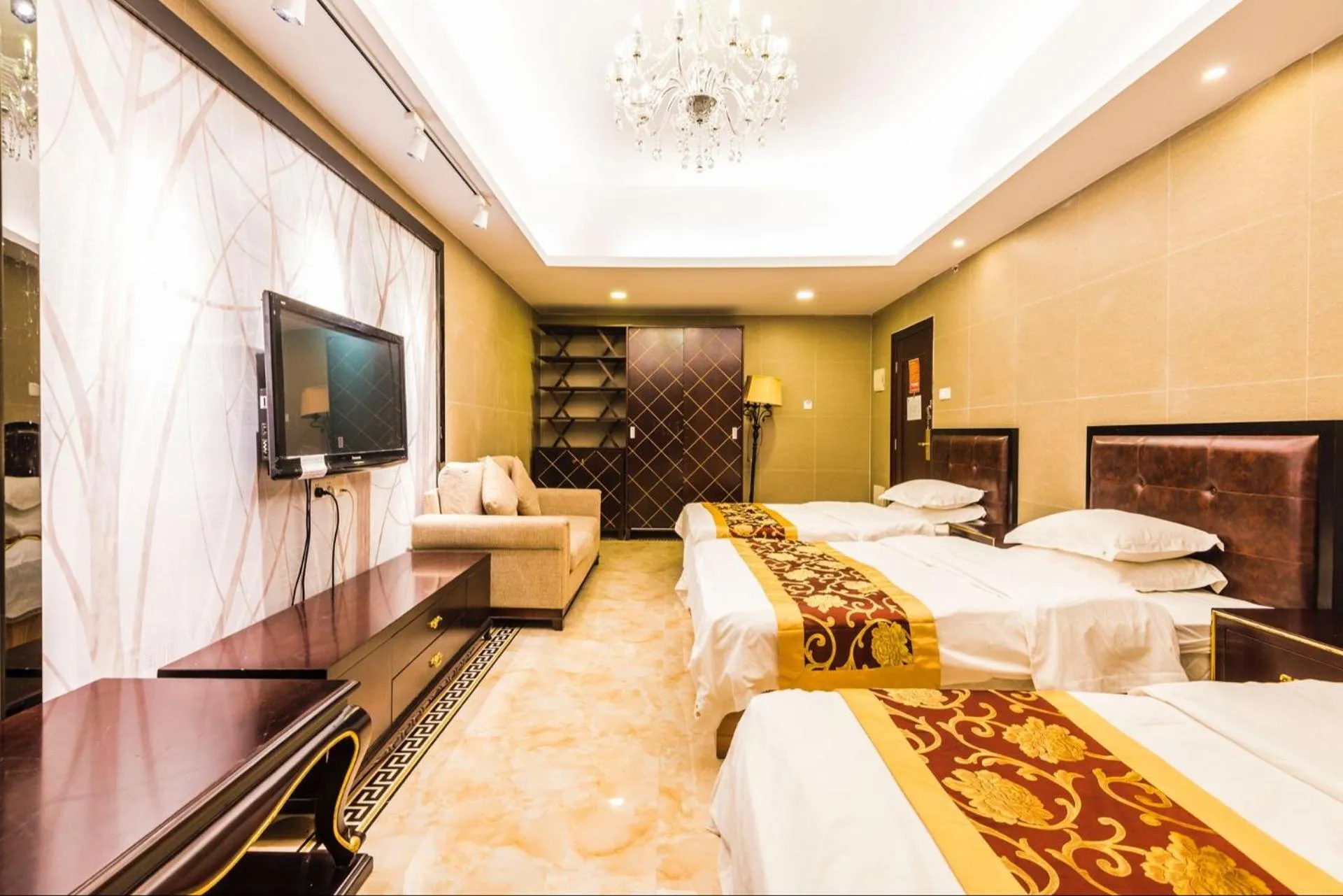 Bed in Grand Continental Apartment