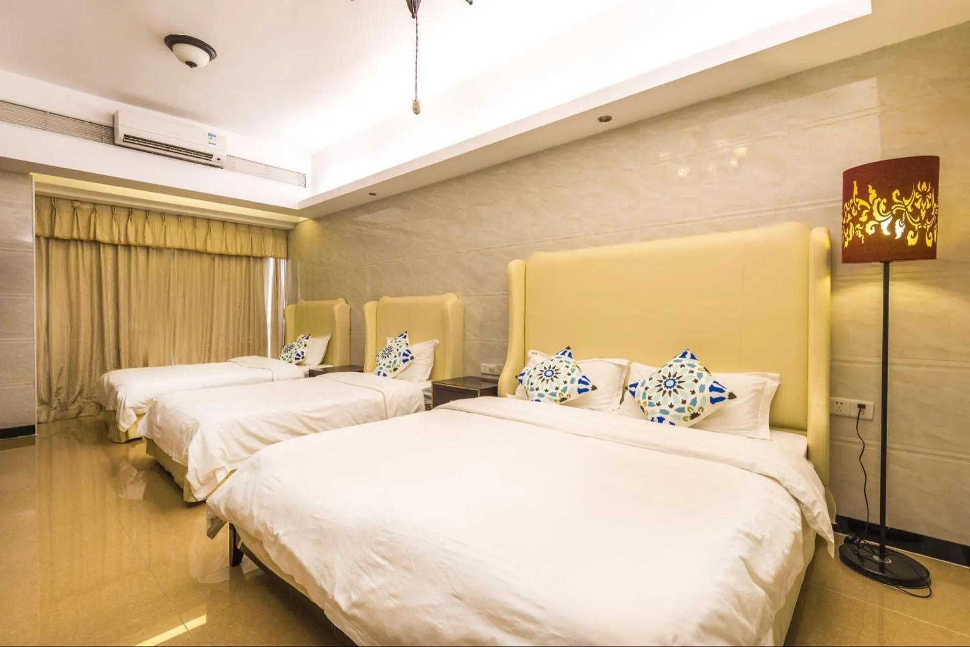 Bed in Grand Continental Apartment