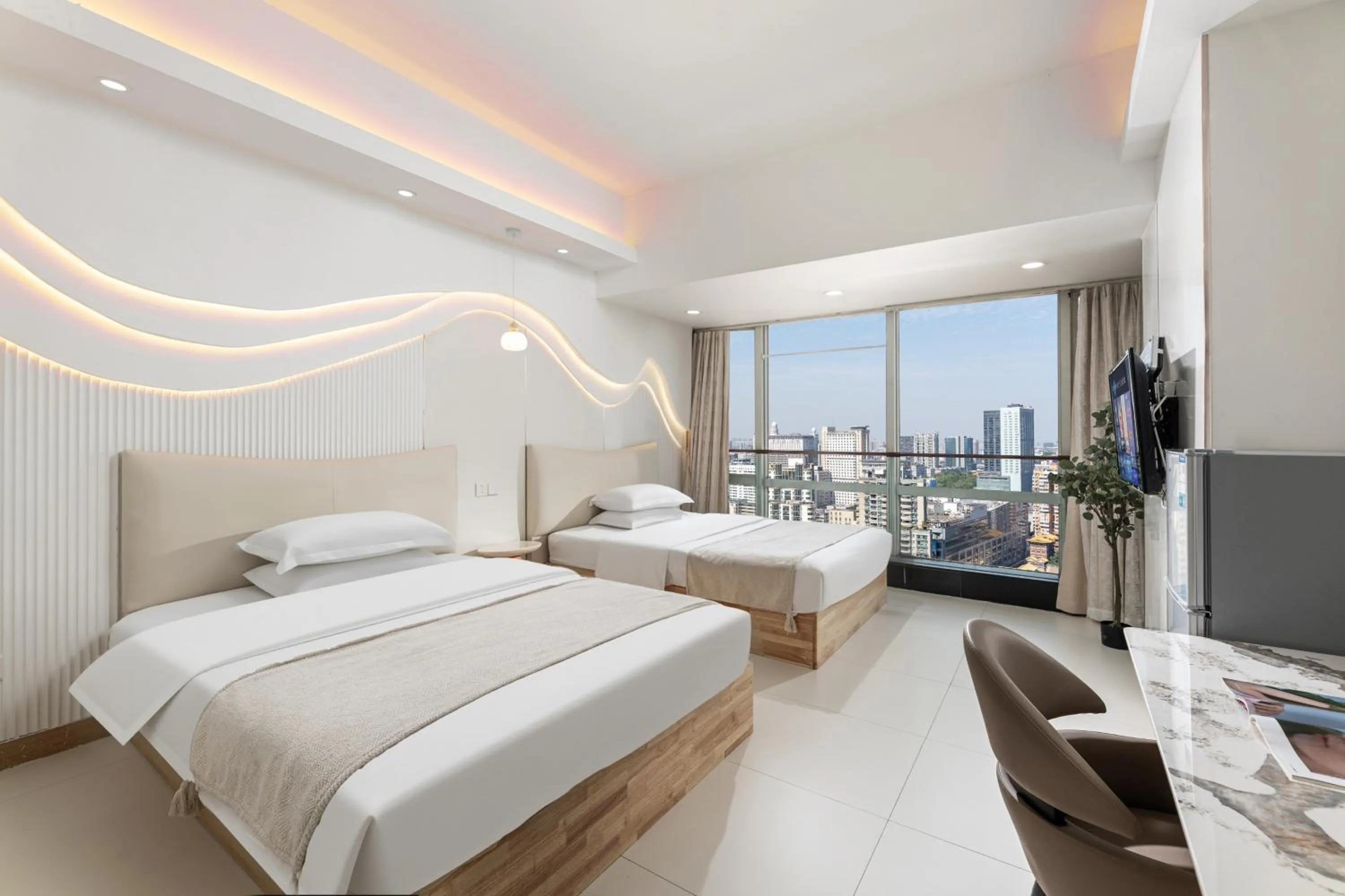 Bed in Grand Continental Apartment