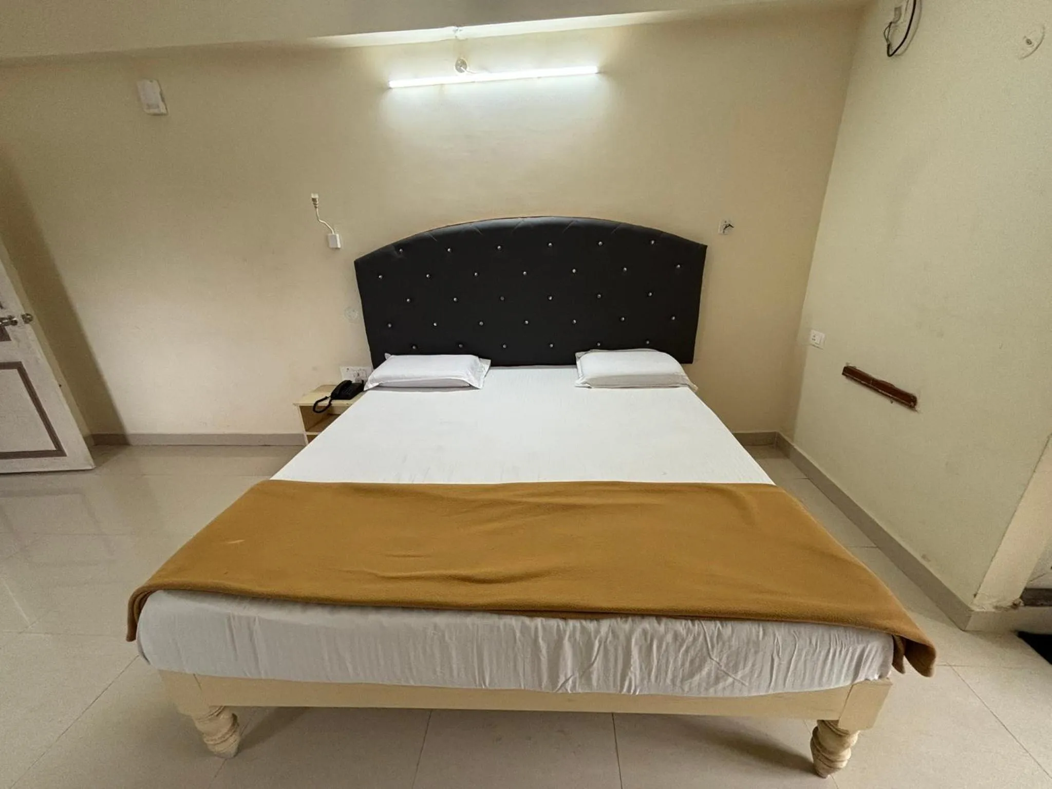 Bed in Srinivasa Hotel