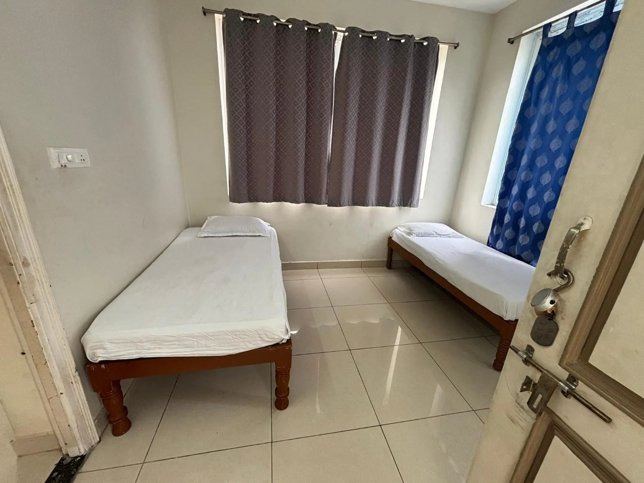 Bed in Srinivasa Hotel