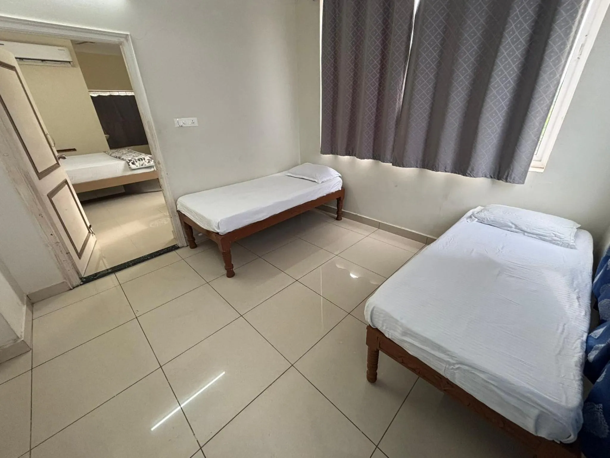 Bed in Srinivasa Hotel