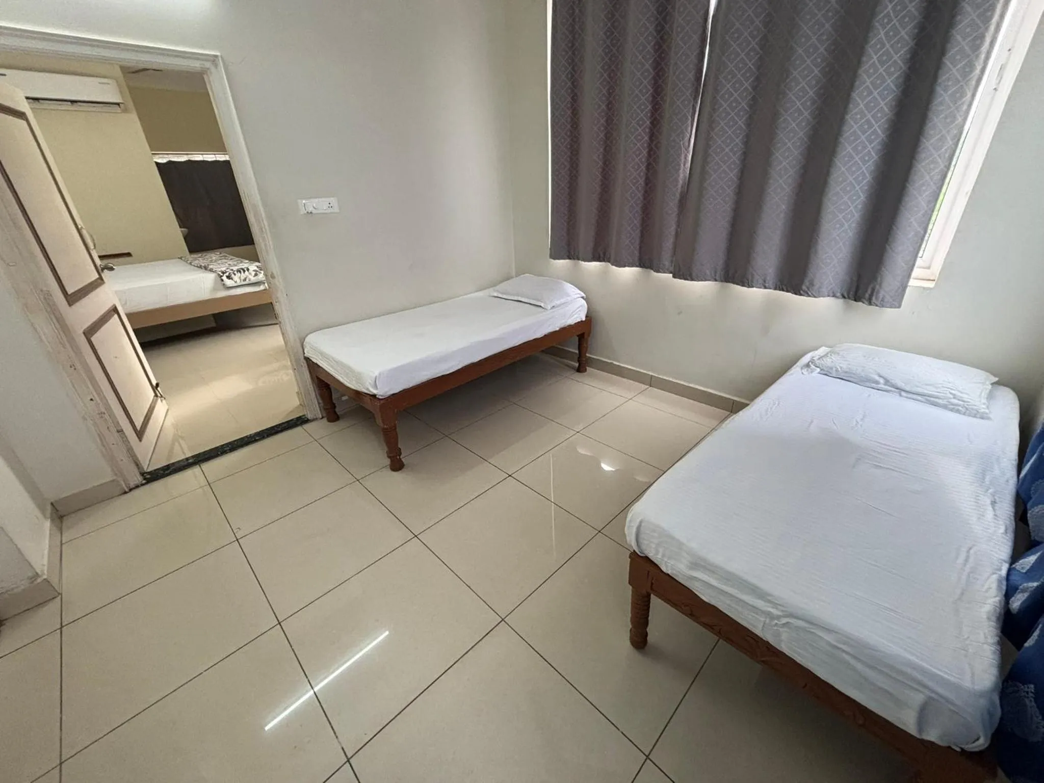 Bed in Srinivasa Hotel