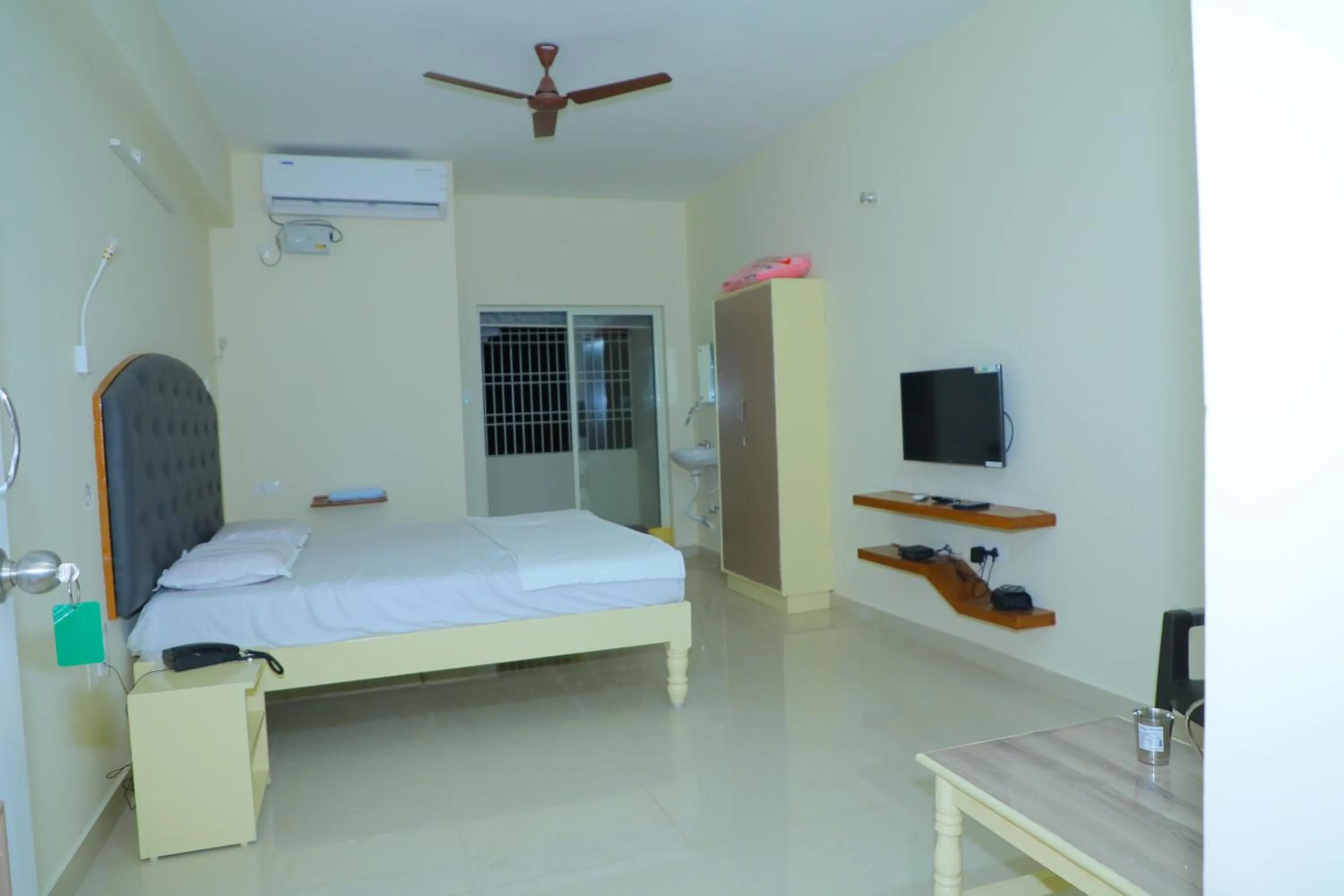 Bed in Srinivasa Hotel