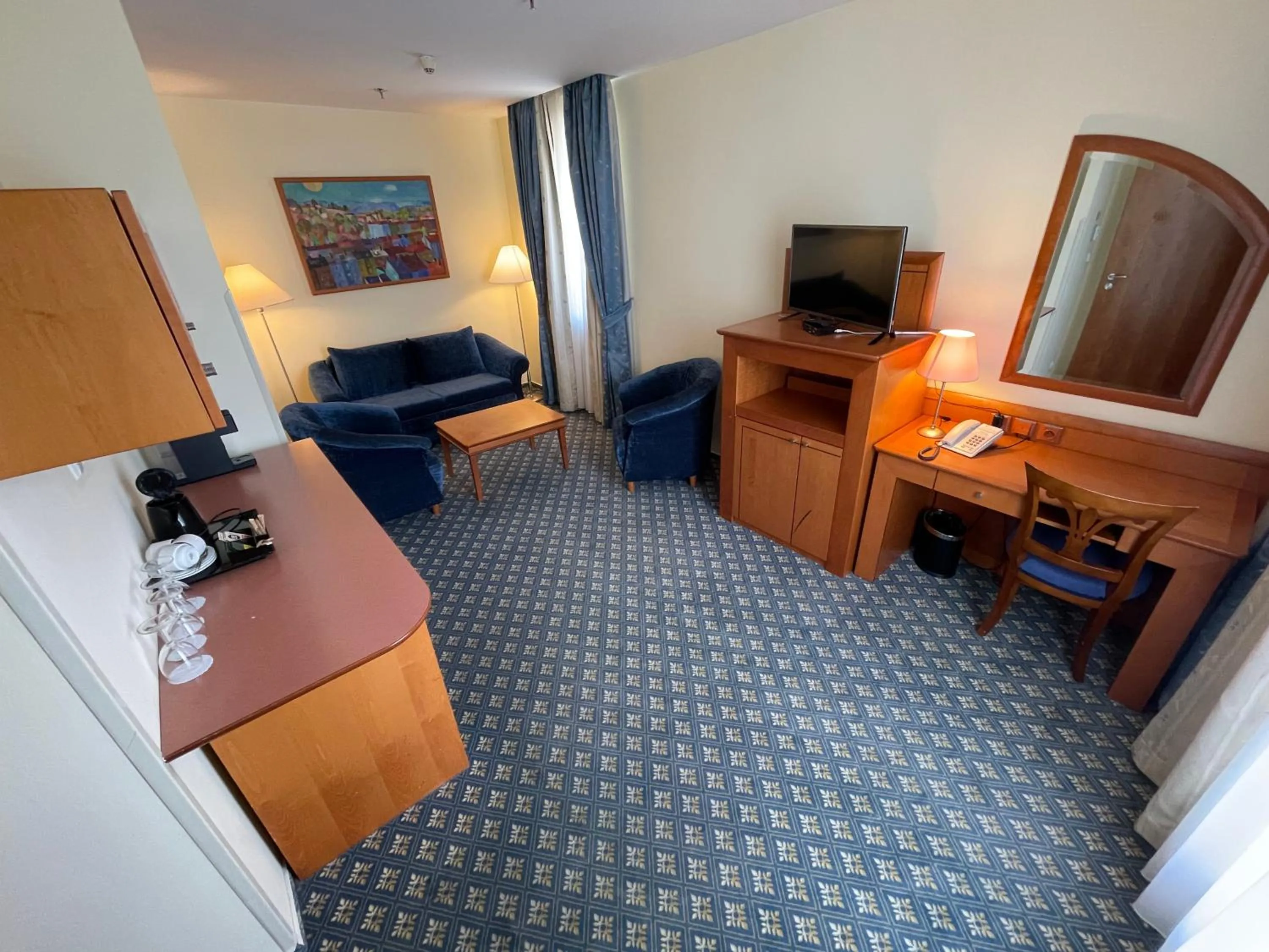 Living room, Bed in Ramada Prague City Centre