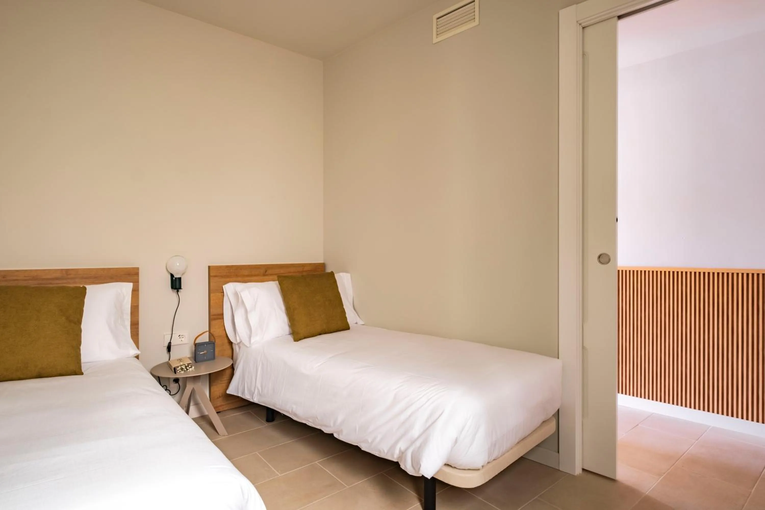 Bedroom, Bed in Aspasios Garden Apartments