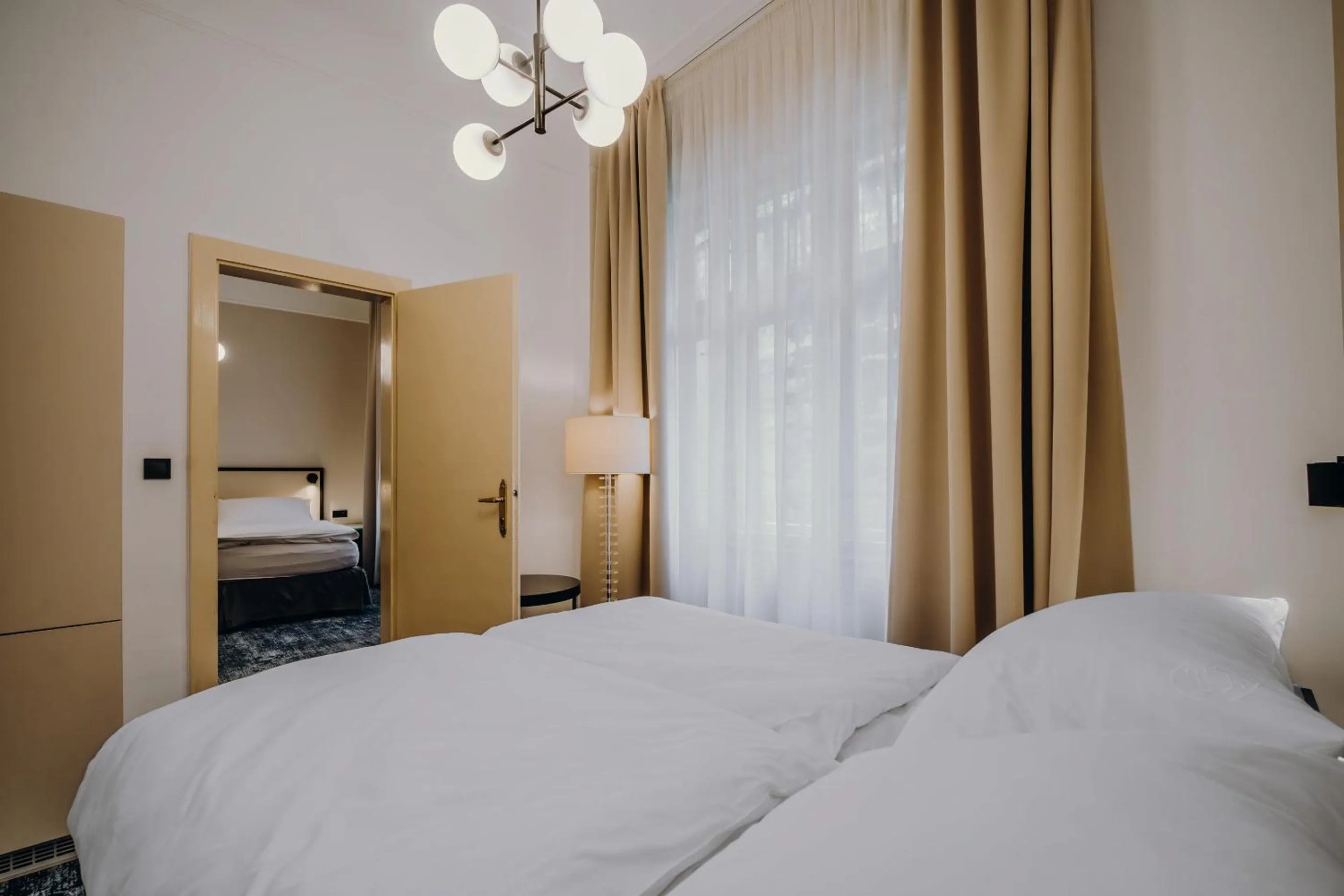 Bed in Esplanade Self Check-in Hotel