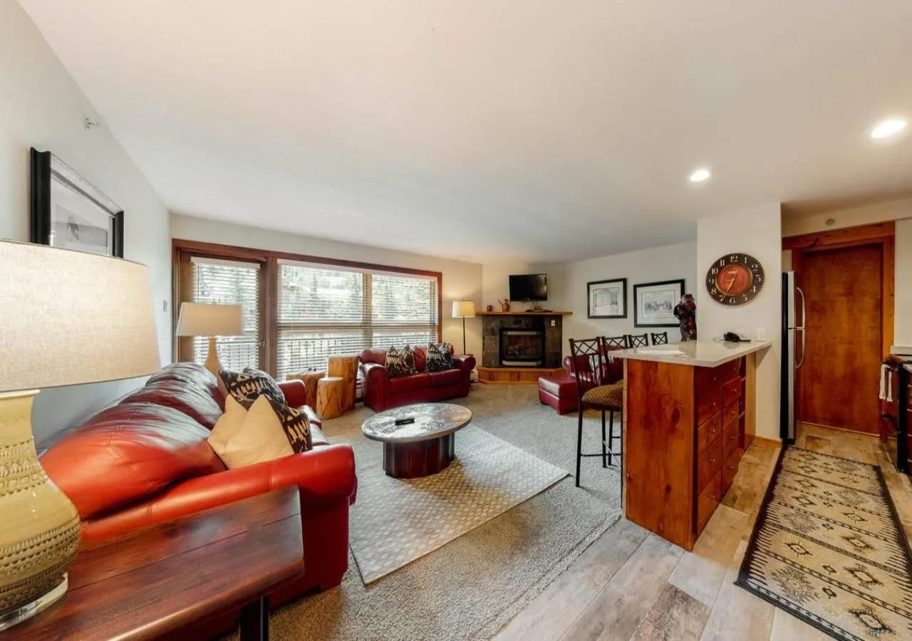 Living room in Lion Square Lodge Condos by TO