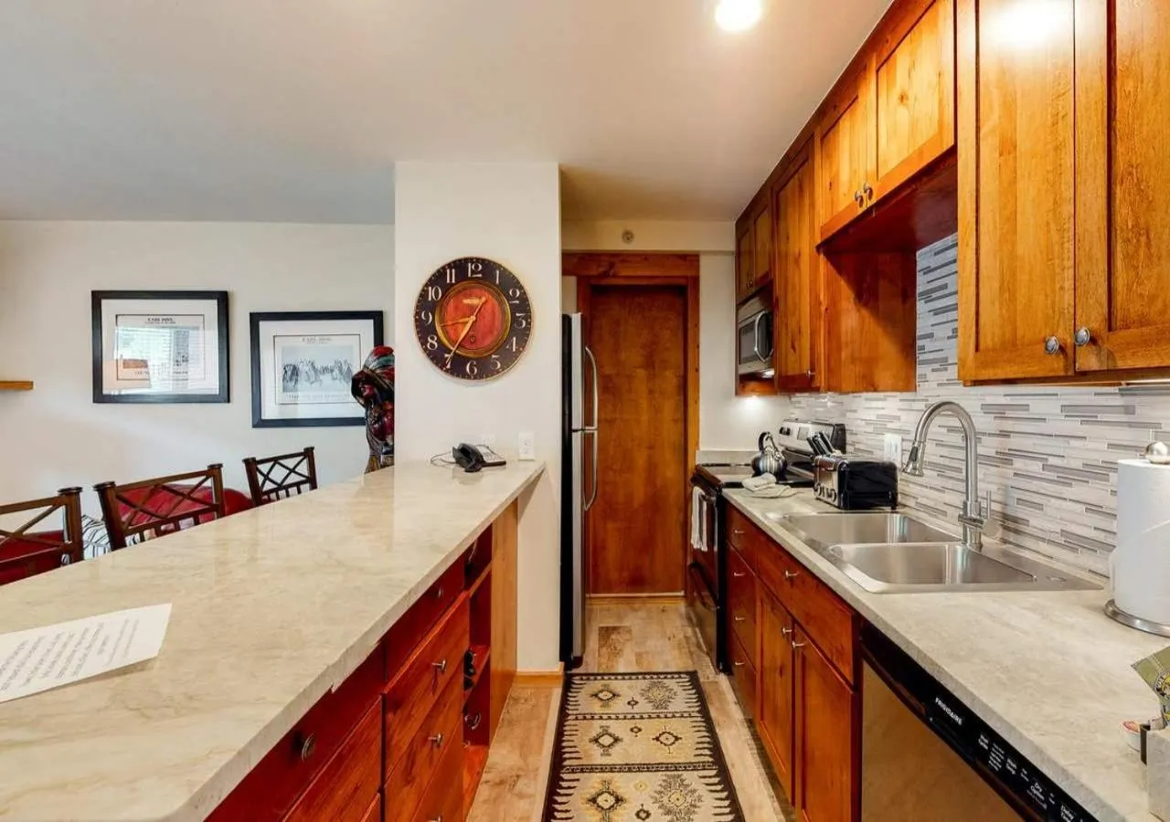 Communal kitchen in Lion Square Lodge Condos by TO